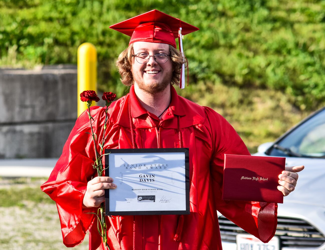 Madison High School drive-thru graduation ceremony at Land of Illusion