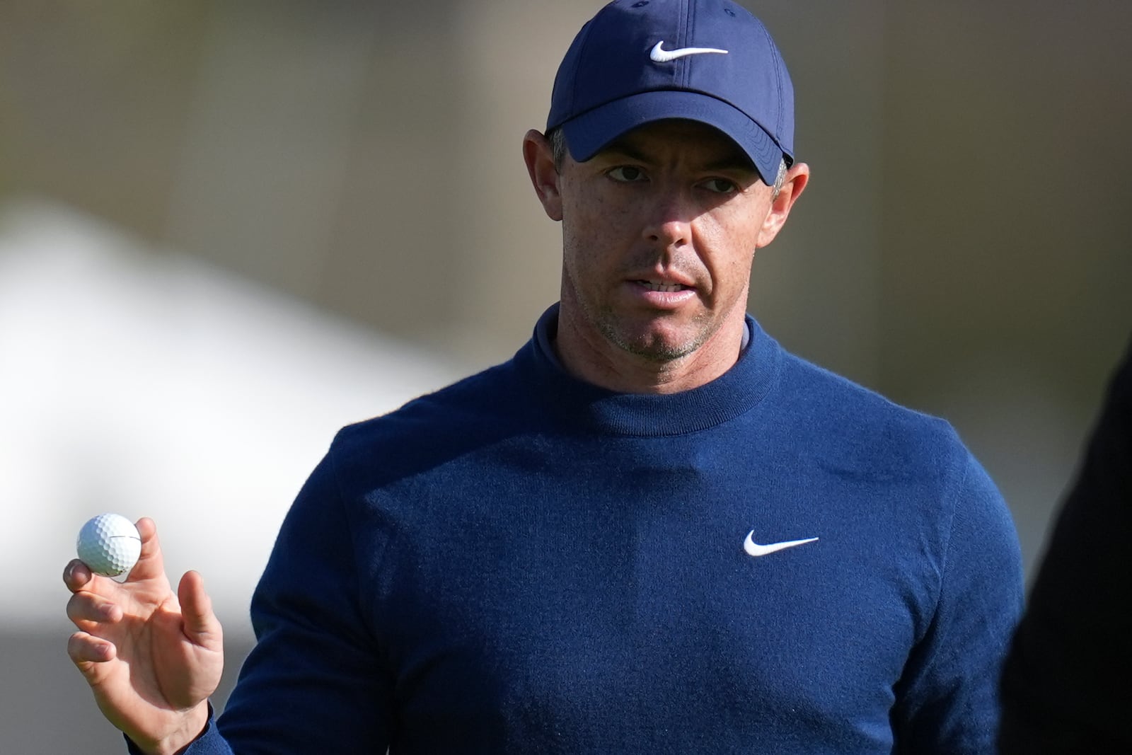 Rory McIlroy, of Northern Ireland, waves after his birdie putt on the 15th green of the South Course at Torrey Pines during the second round of the Genesis Invitational golf tournament Friday, Feb. 14, 2025, in San Diego. (AP Photo/Gregory Bull)