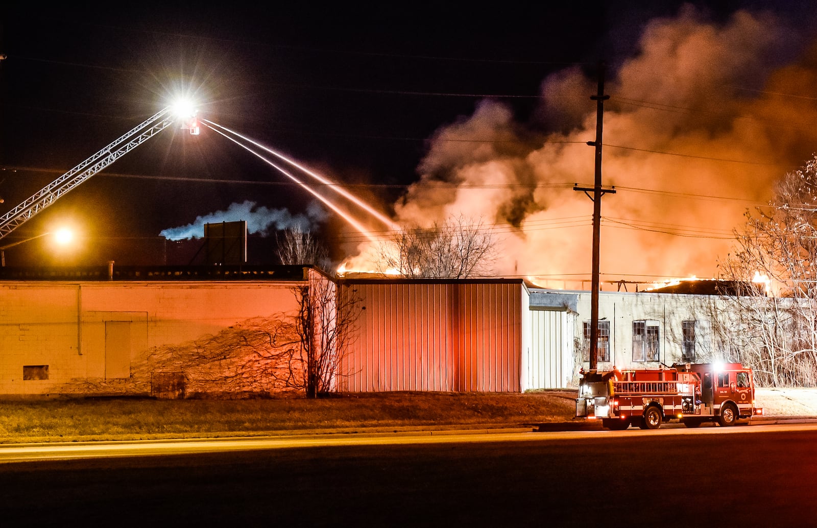 Fire crews from multiple departments battle a fire in the former Middletown Paperboard building on Verity Parkway Friday, Feb. 2 in Middletown. NICK GRAHAM/STAFF