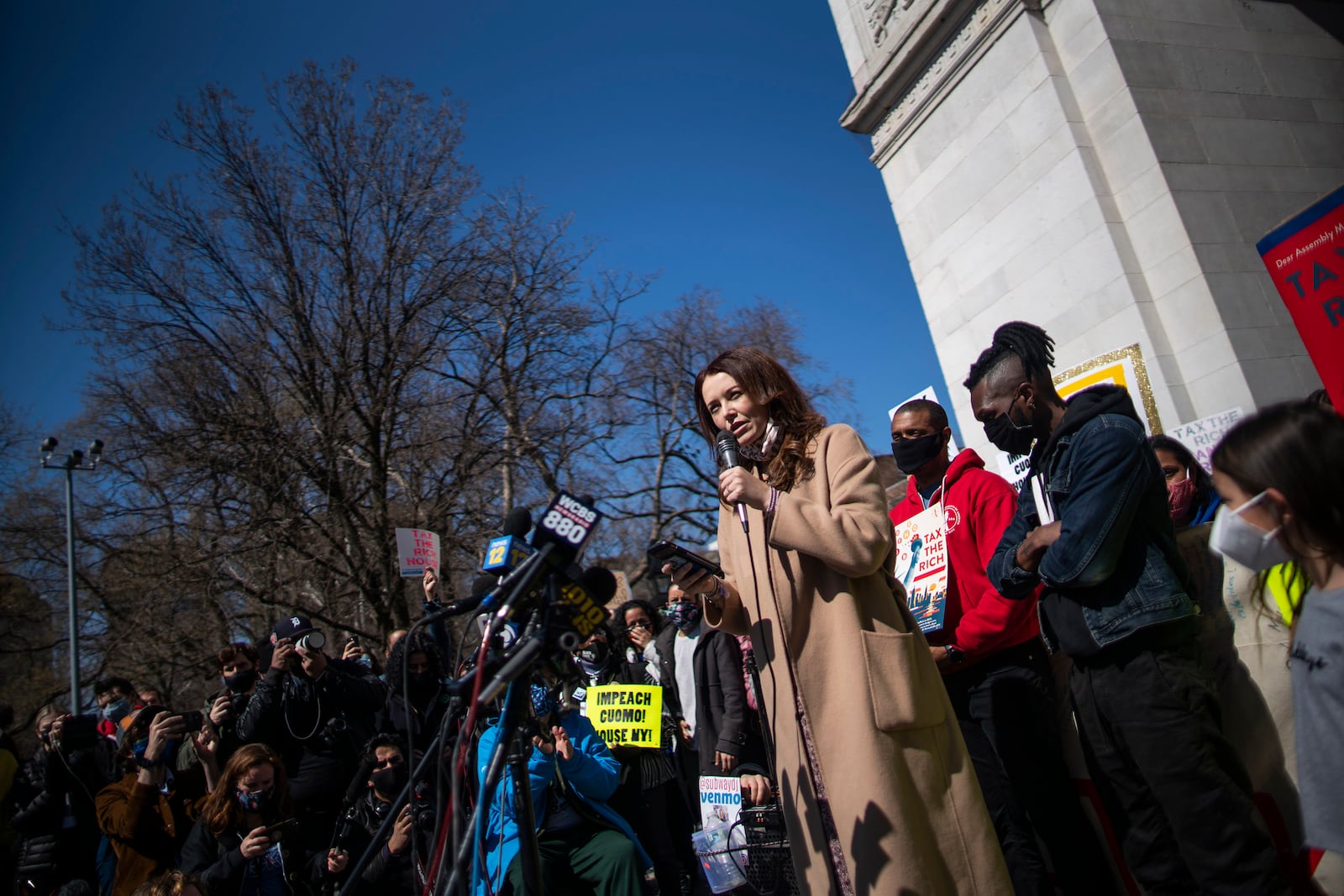 FILE - Lindsey Boylan, left, a former adviser for Gov. Andrew Cuomo, speaks at a march calling for his impeachment at Washington Square Park, March. 20, 2021, in New York. (AP Photo/Eduardo Munoz Alvarez, File)