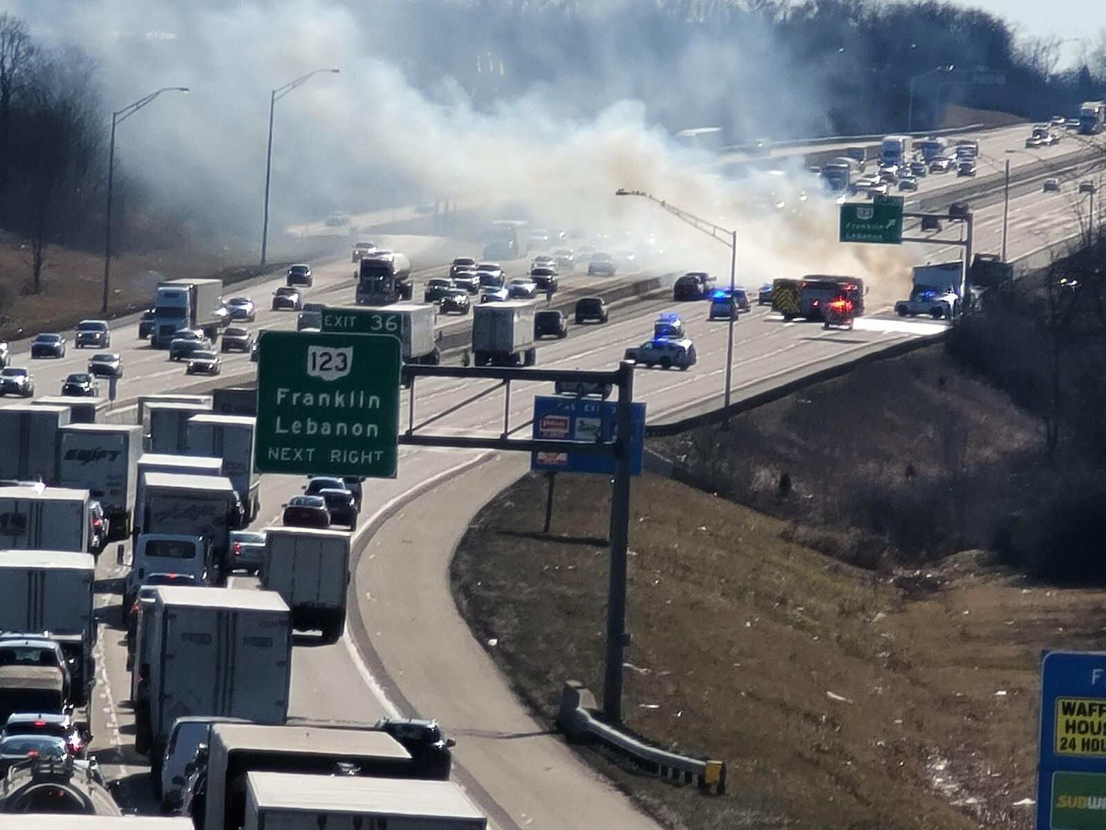 A mobile home caught fire in the southbound lanes of Interstate 75 at the Ohio 123 exit in Franklin Thursday, Feb. 25, 2021. NICK GRAHAM/STAFF