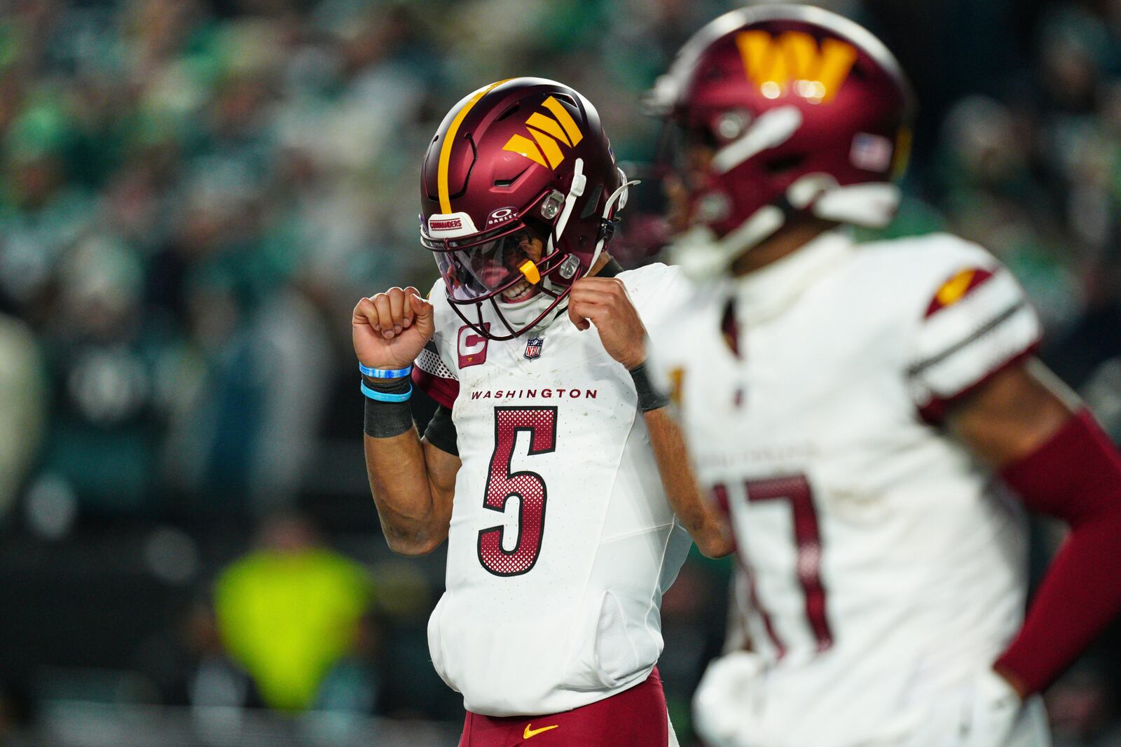 Washington Commanders quarterback Jayden Daniels (5) celebrates after scoring a touchdown against the Philadelphia Eagles during the second half of the NFC Championship NFL football game, Sunday, Jan. 26, 2025, in Philadelphia. (AP Photo/Derik Hamilton)