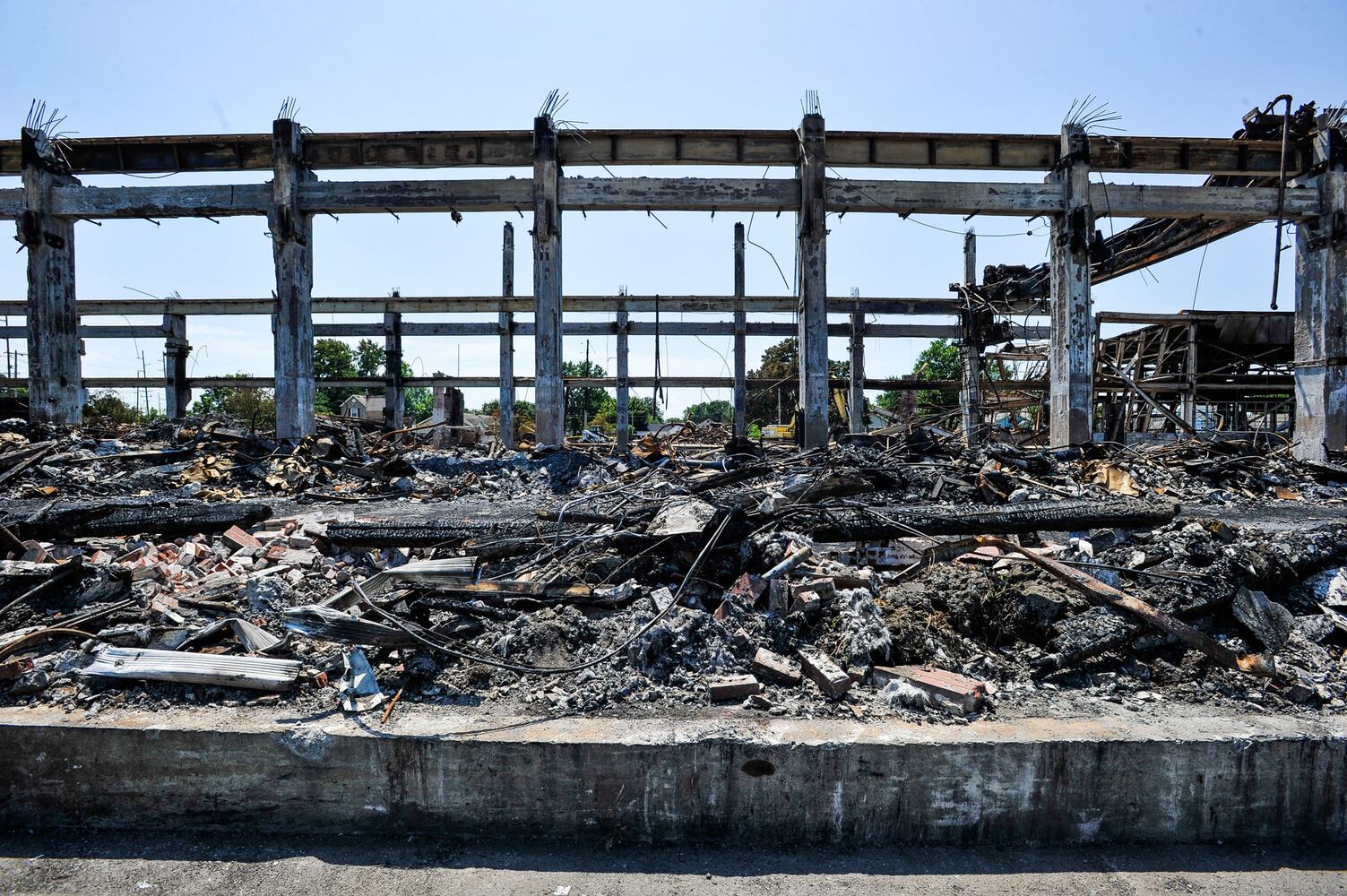 Crews demolish warehouse after massive fire in Hamilton