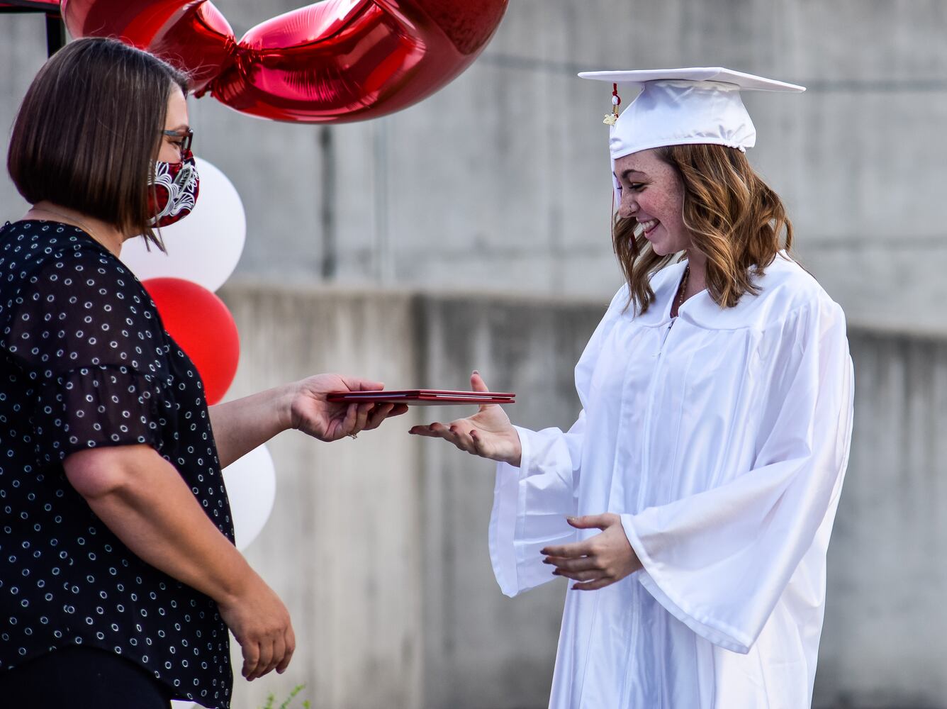 Madison High School drive-thru graduation ceremony at Land of Illusion