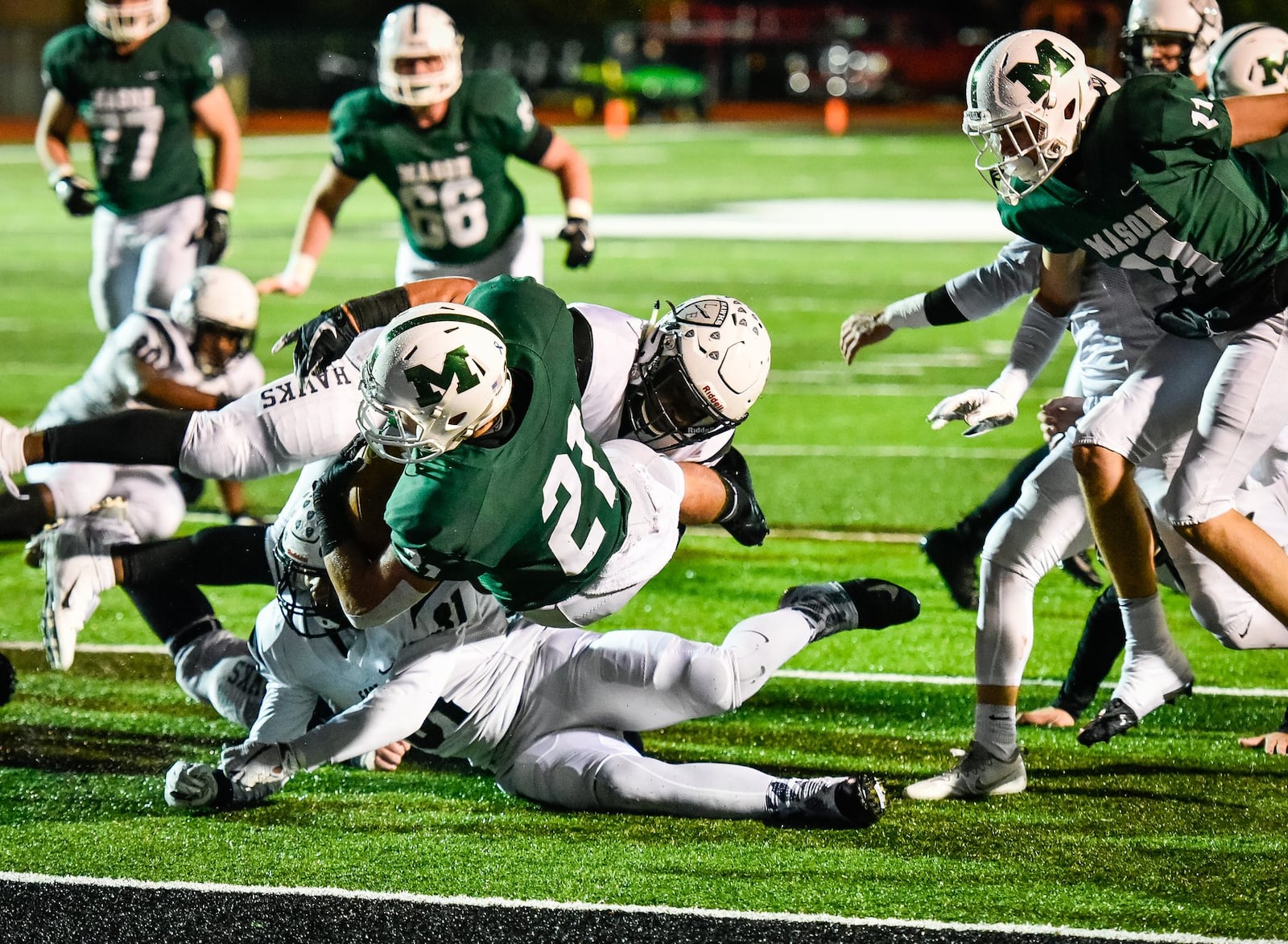 Mason’s Nolan McCormick dives into the end zone Friday night during a Division I, Region 4 playoff opener against Lakota East at Dwire Field in Mason. East won 20-17. NICK GRAHAM/STAFF