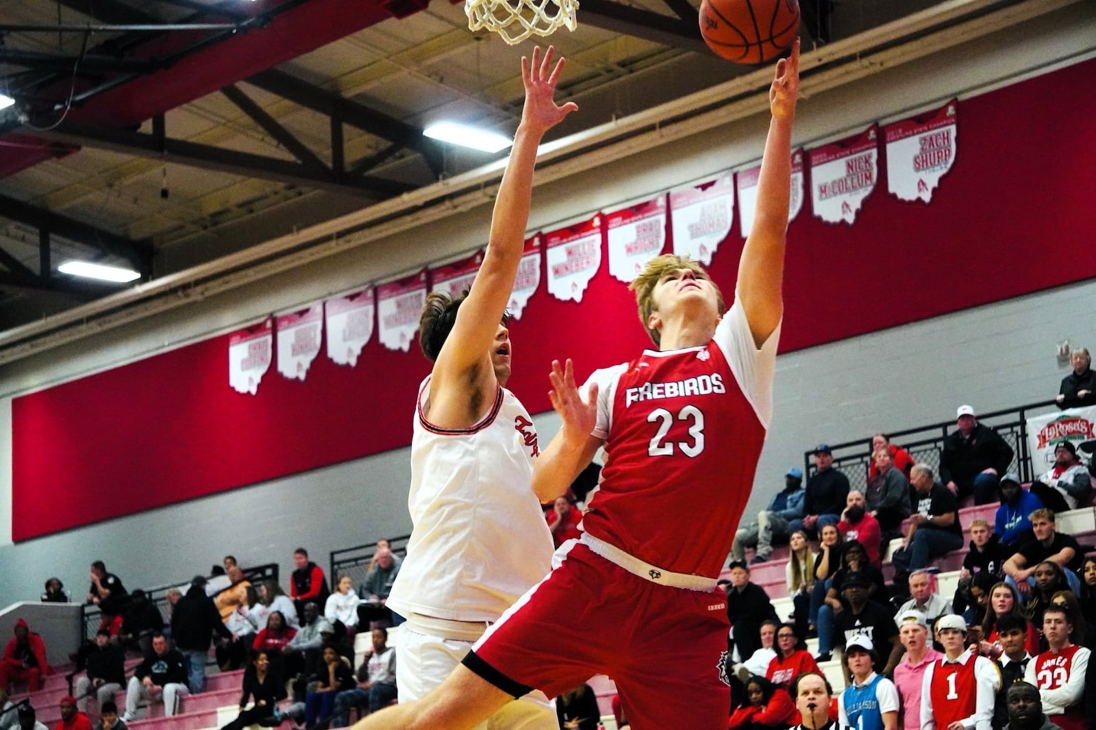 Lakota West's LJ Green goes up for a basket as Fairfield's Gave Clemmons applies the defense. Chris Vogt/CONTRIBUTED