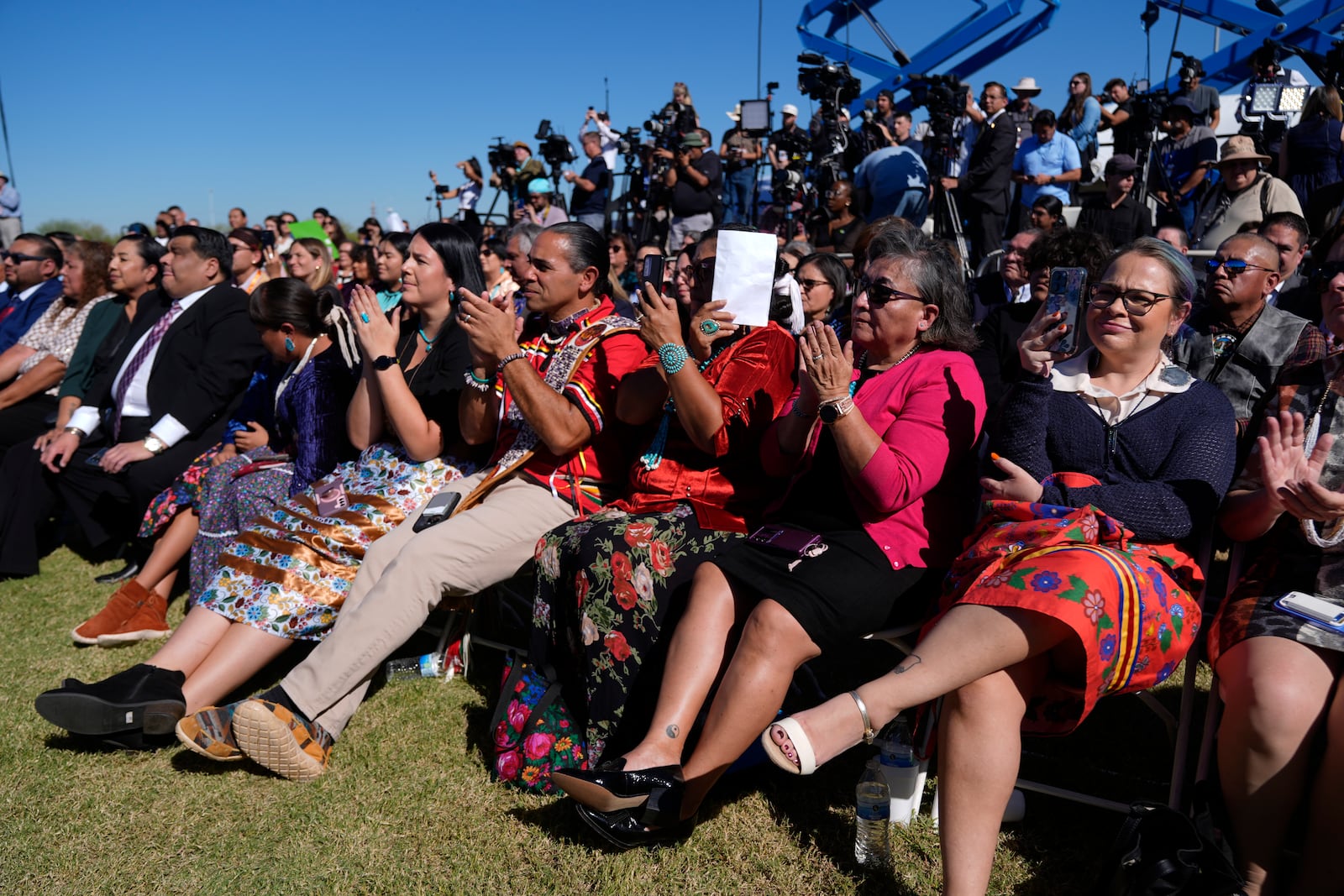 Attendees listen as Interior Secretary Deb Haaland speaks before President Joe Biden at the Gila Crossing Community School in the Gila River Indian Community reservation in Laveen, Ariz., Friday, Oct. 25, 2024. (AP Photo/Manuel Balce Ceneta)