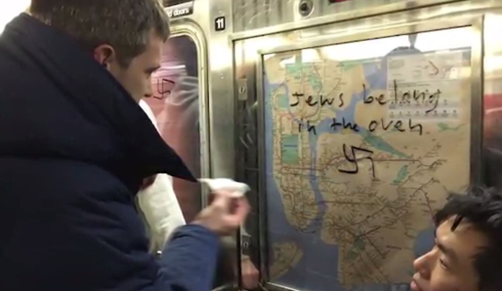 Chef Jared Nied cleans off swastikas scrawled in a New York subway car.