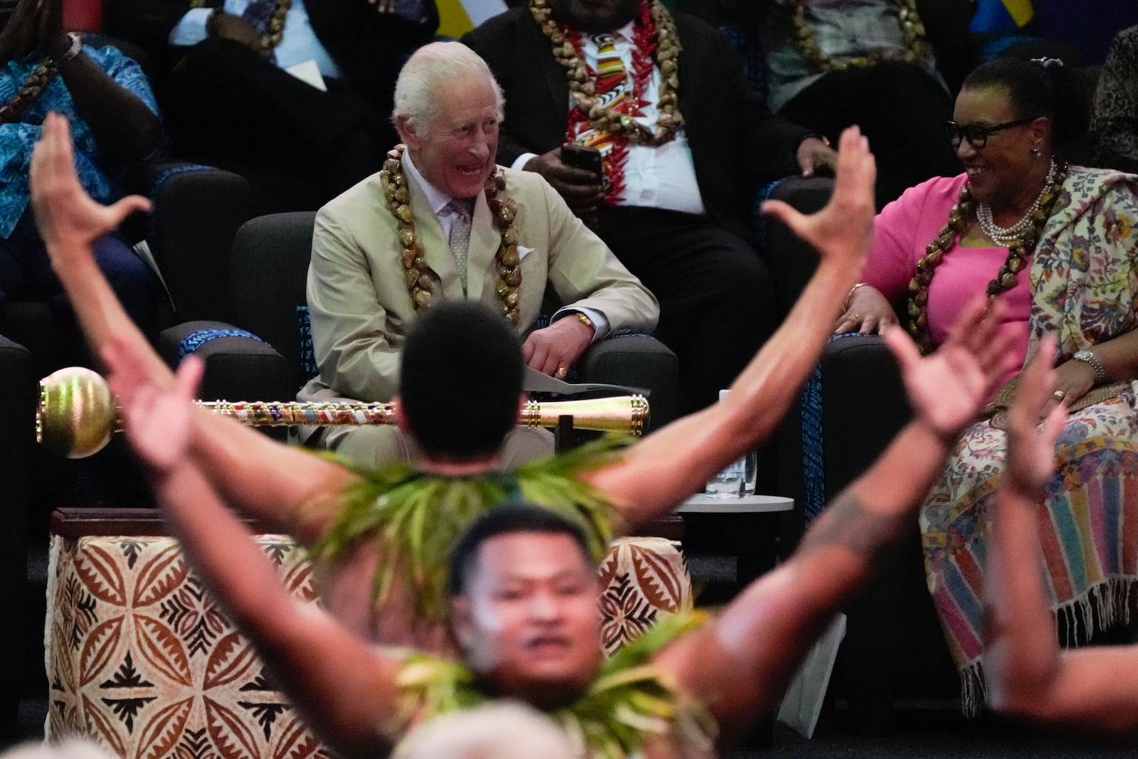 Britain's King Charles watches as dancers perform during the opening ceremony for the Commonwealth Heads of Government meeting in Apia, Samoa, Friday, Oct. 25, 2024. (AP Photo/Rick Rycroft/Pool)