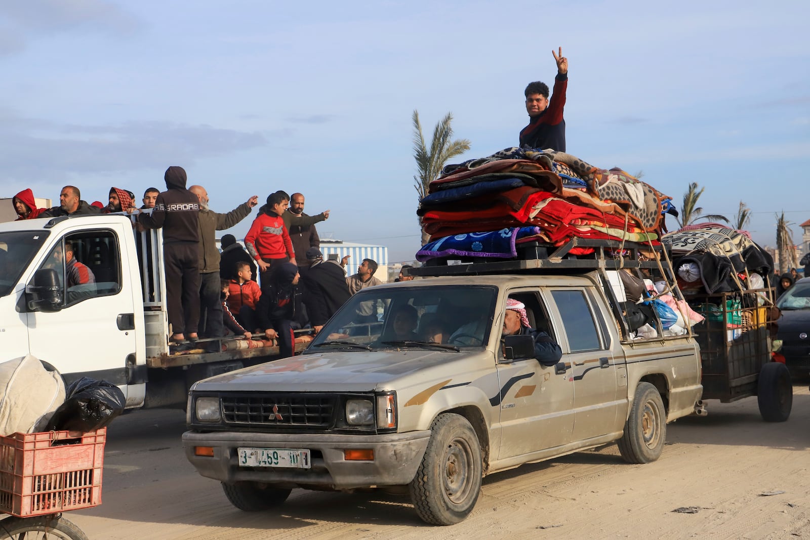 Displaced Palestinians return to Rafah, as a ceasefire deal between Israel and Hamas went into effect, in Rafah, Gaza Strip, Sunday, Jan. 19, 2025. (AP Photo/Mariam Dagga)