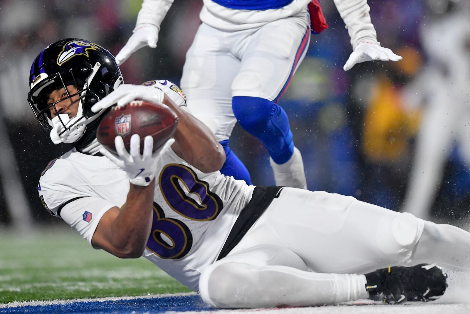 Baltimore Ravens tight end Isaiah Likely (80) makes a touchdown catch against the Buffalo Bills during the fourth quarter of an NFL divisional playoff football game, Sunday, Jan. 19, 2025, in Orchard Park, N.Y. (AP Photo/Adrian Kraus)