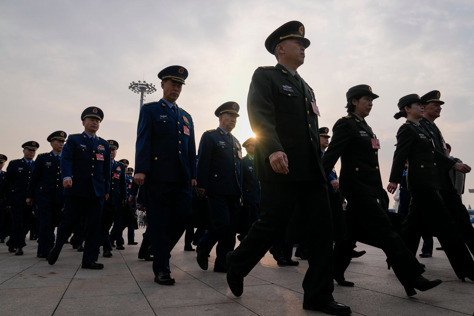 Military delegates march ahead of the opening session of the National People's Congress (NPC) at the Great Hall of the People in Beijing, China, Wednesday, March 5, 2025. (AP Photo/Andy Wong)