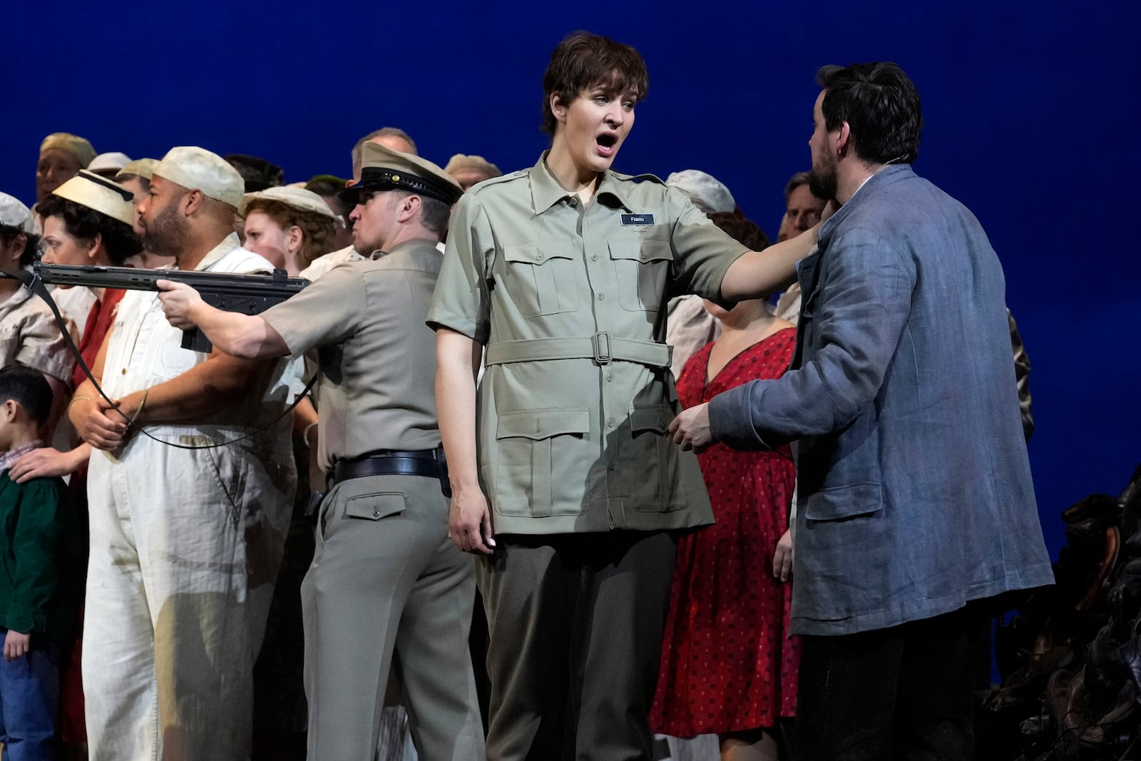 Soprano Lise Davidsen, center, performs as Leonore, with tenor David Butt Philip, right, as Florestan, her husband, during a dress rehearsal of Beethoven's "Fidelio," at New York's Metropolitan Opera, Friday, Feb. 28, 2025. (AP Photo/Richard Drew)