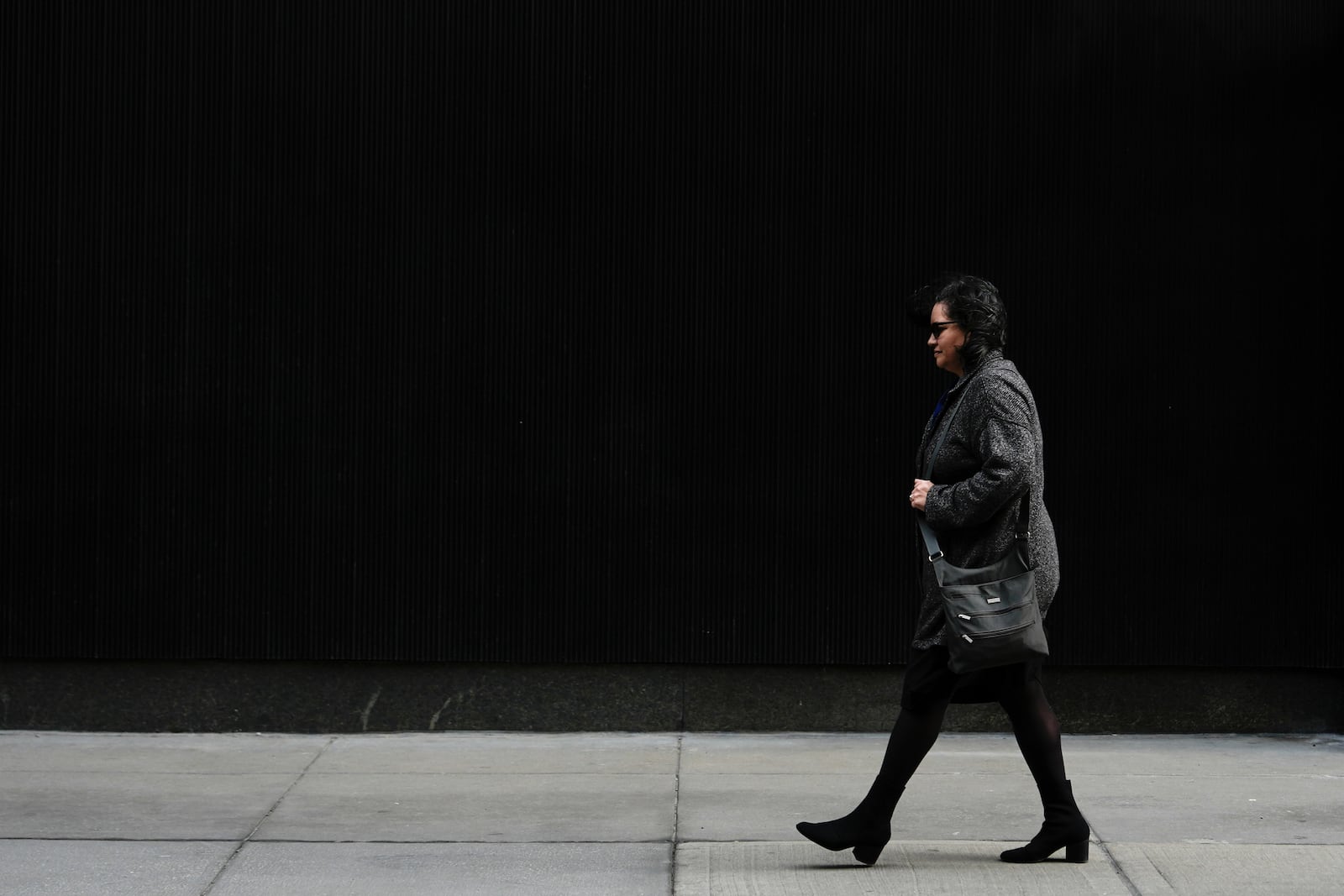 Karen Ortiz, an administrative judge at the Equal Employment Opportunity Commission, walks to her office, Wednesday, Feb. 26, 2025, in New York. (AP Photo/Julia Demaree Nikhinson)