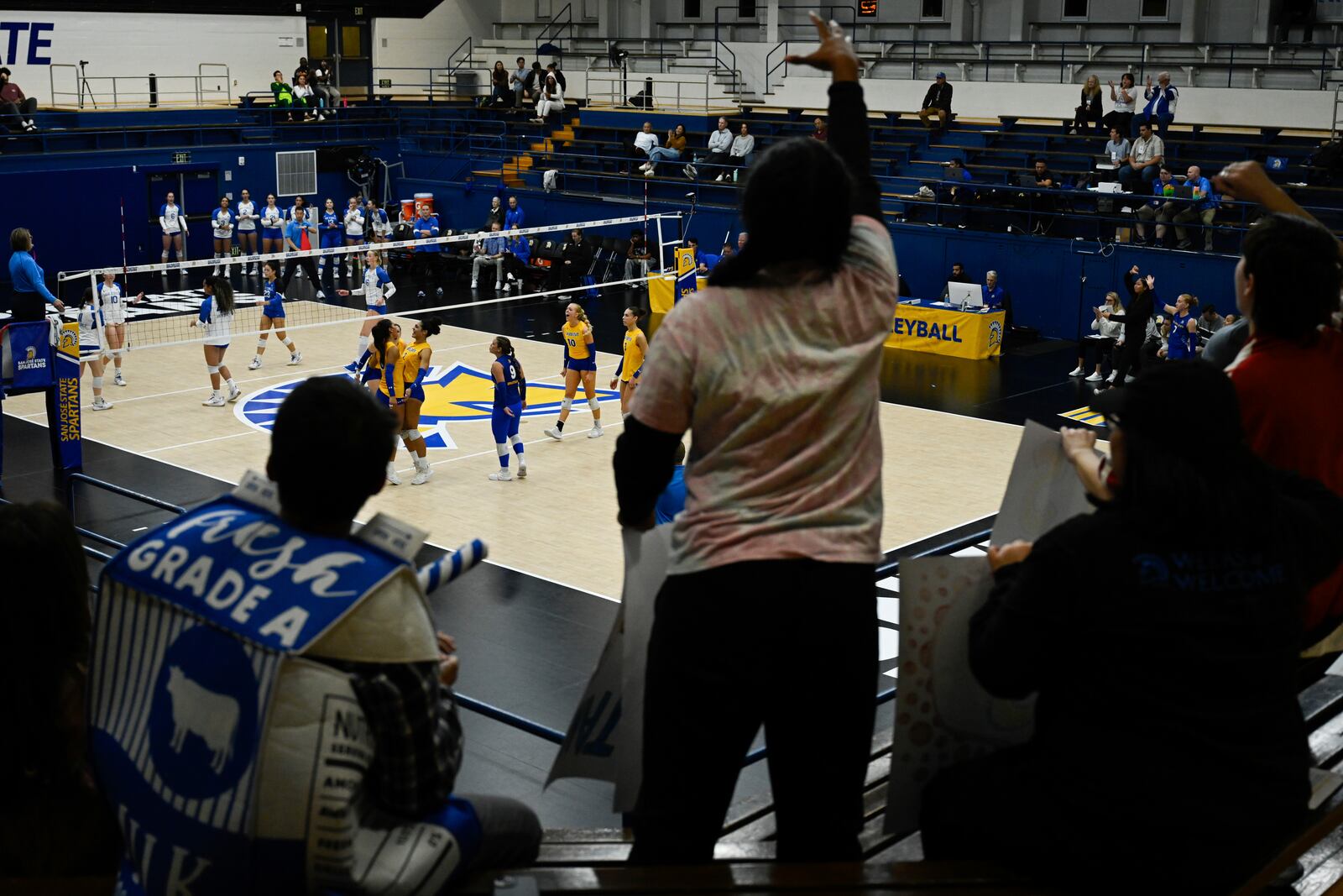 Fans celebrate a point by the San Jose State Spartans against the Air Force Falcons during the fourth set of an NCAA college volleyball match Thursday, Oct. 31, 2024, in San Jose, Calif. (AP Photo/Eakin Howard)