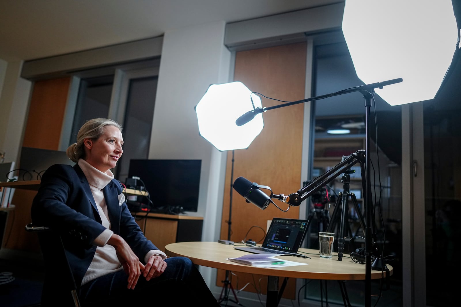 Alice Weidel, parliamentary group leader, party chairwoman and candidate for chancellor of the AfD, prepares for a live X interview with U.S. billionaire Elon Musk in her office in the Jakob Kaiser House in Berlin, on Thursday, Jan. 9, 2025. (Kay Nietfeld/Pool Photo via AP)