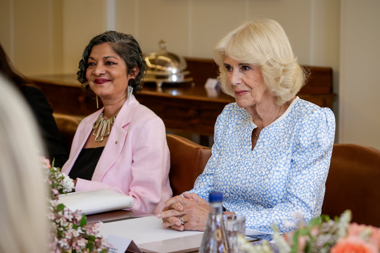 Queen Camilla, right, takes part in a discussion on family and domestic violence at Government House in Yarralumla at Canberra, Australia, Monday, Oct. 21, 2024. (Brook Mitchell/Pool Photo via AP)