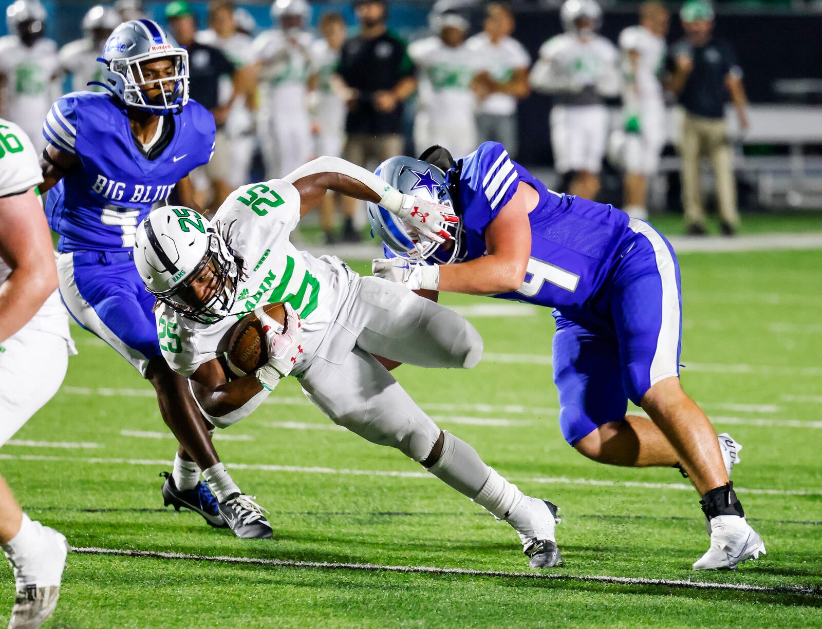 Badin's Lem Grayson carries the ball during their football game against Hamilton Friday, Aug. 18, 2023 at Hamilton's Virgil Schwarm Stadium. Badin defeated Hamilton 18-0 during the showdown at the Schwarm. NICK GRAHAM/STAFF