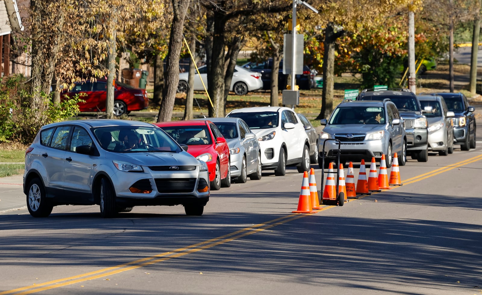 Cars line up to pick up students from Kramer Elementary School in Oxford. Talawanda school officials have eliminated busing to the high school and implemented a 2-mile radius for other schools. NICK GRAHAMSTAFF 