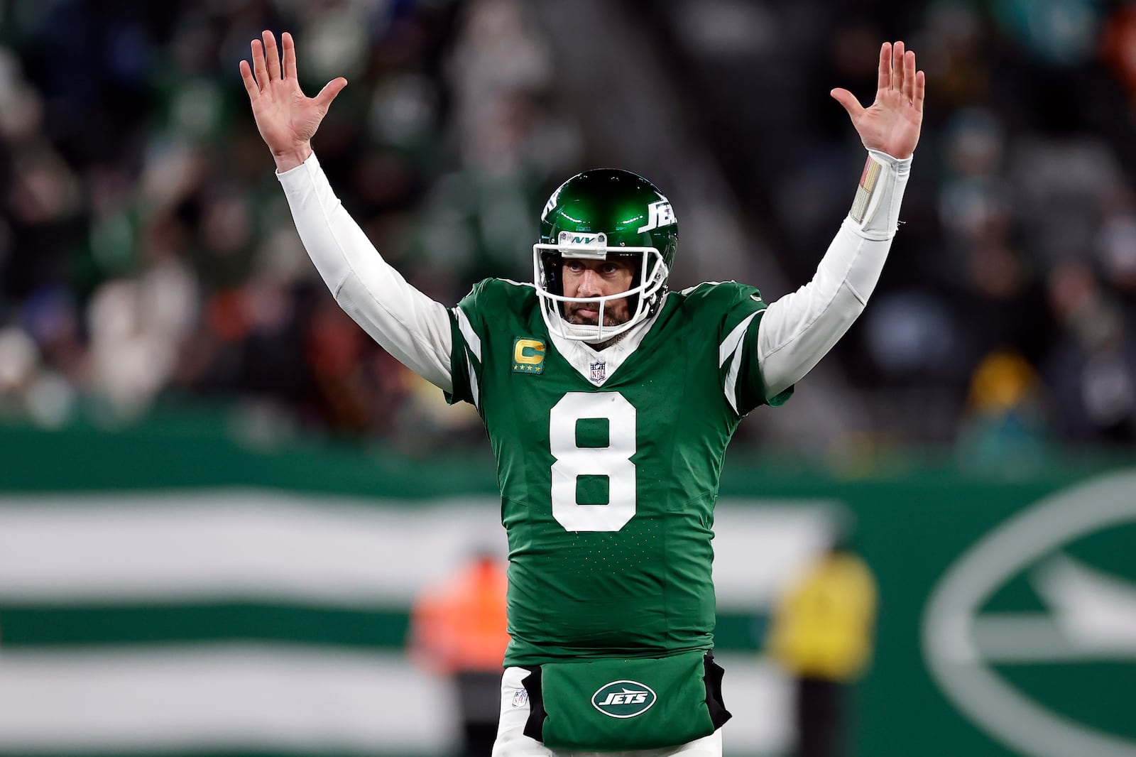 FILE - New York Jets quarterback Aaron Rodgers (8) reacts after a touchdown pass during an NFL football game against the Miami Dolphins Sunday, Jan. 5, 2025, in East Rutherford, N.J. (AP Photo/Adam Hunger, File)