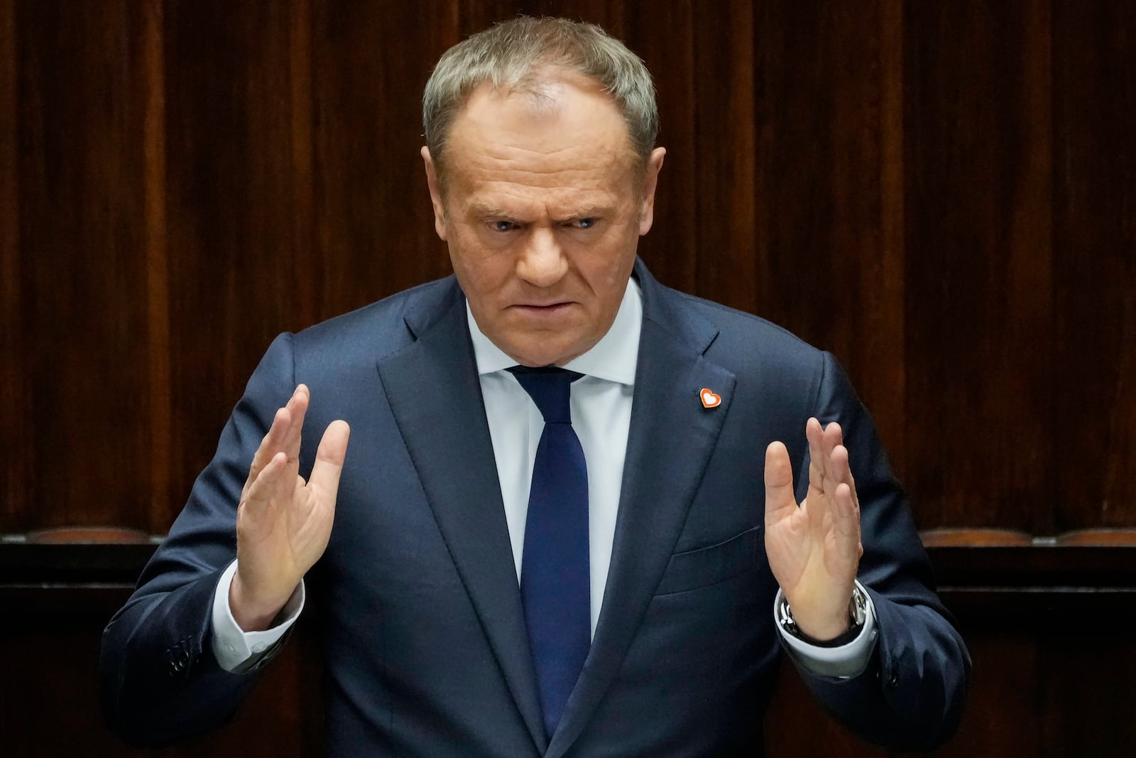 Polish Prime Minister Donald Tusk speaks at the Sejm, the lower house of parliament, in Warsaw, Poland, Friday March 7, 2025. (AP Photo/Czarek Sokolowski)