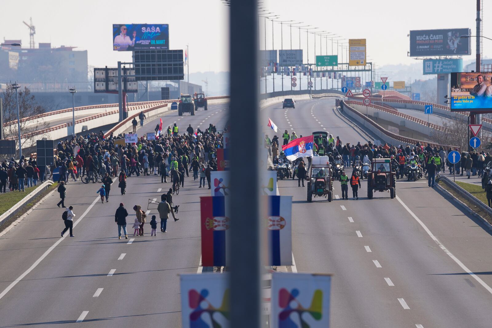 People participate in a 7-hour long blockade of a highway in Belgrade, Serbia, Sunday, Feb. 9, 2025, to protest the Nov. 1. collapse of a concrete canopy at the central train station in Novi Sad, that killed 15 people. (AP Photo/Darko Vojinovic)