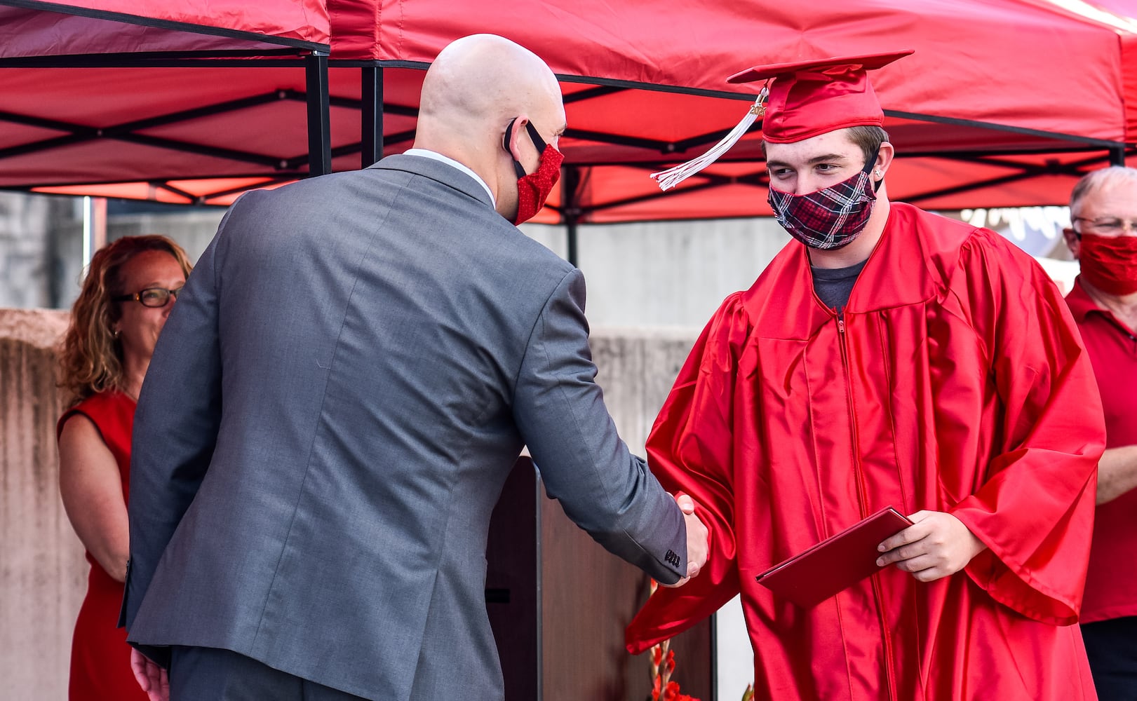 Madison High School drive-thru graduation ceremony at Land of Illusion