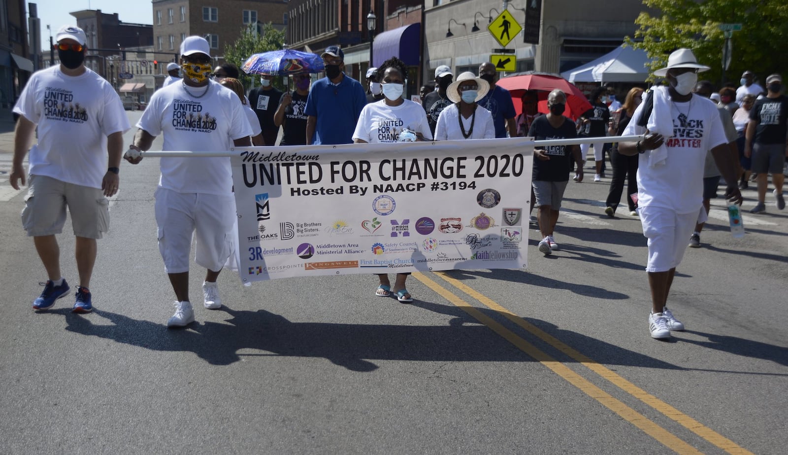 Middletown citizens, community leaders and government leaders marched together from the bus depot to One Donham Plaza on Saturday, June 20, 2020, to show they are a city united together and determined to be a leader in change. MICHAEL D. PITMAN/STAFF