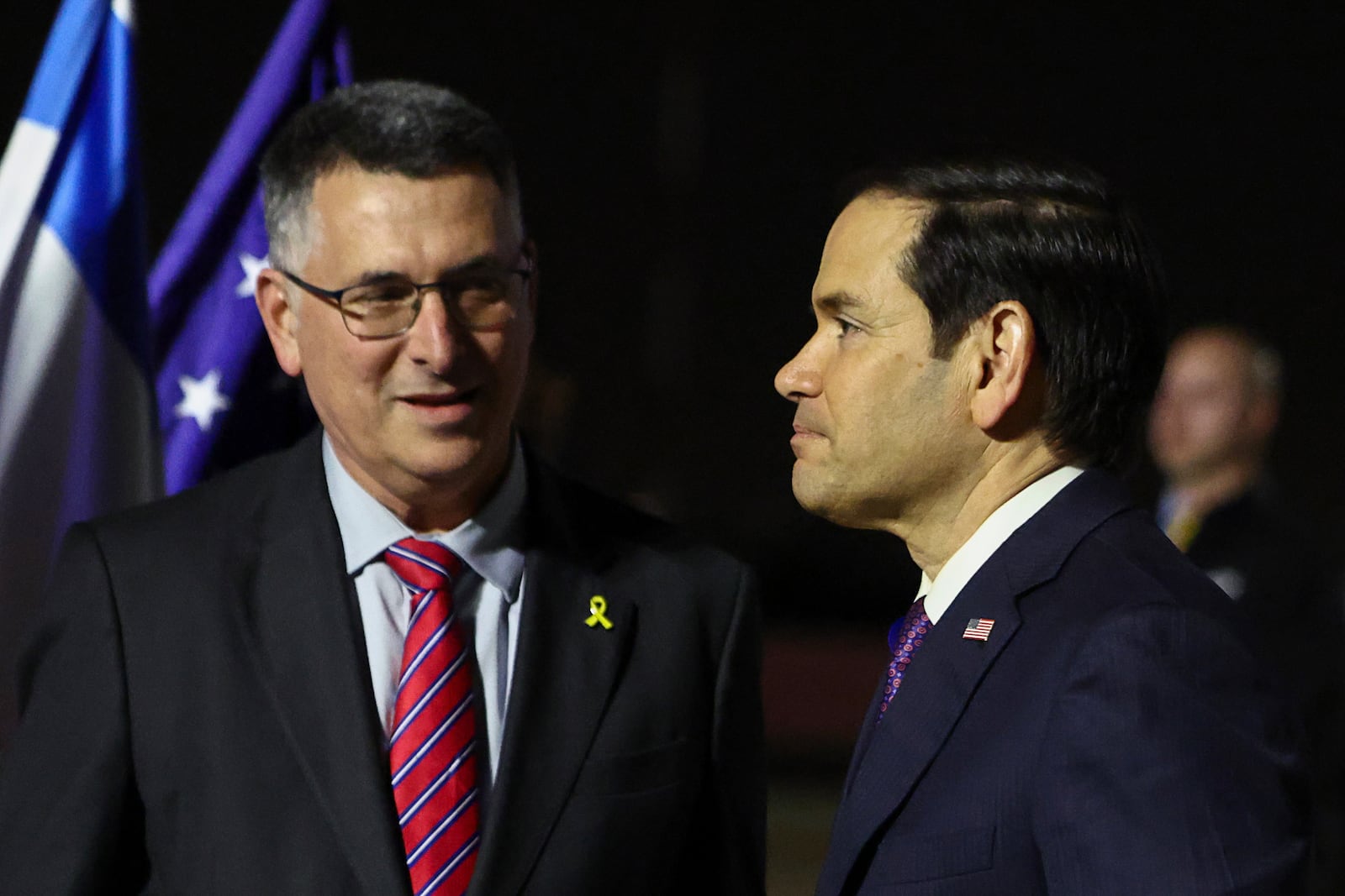 Israel's Foreign Minister Gideon Sa'ar welcomes U.S. Secretary of State Marco Rubio as he arrives in Israel, on the first leg of his Middle East trip, in Tel Aviv, Israel, on Saturday, Feb. 15, 2025. (Evelyn Hockstein/Pool Photo via AP)