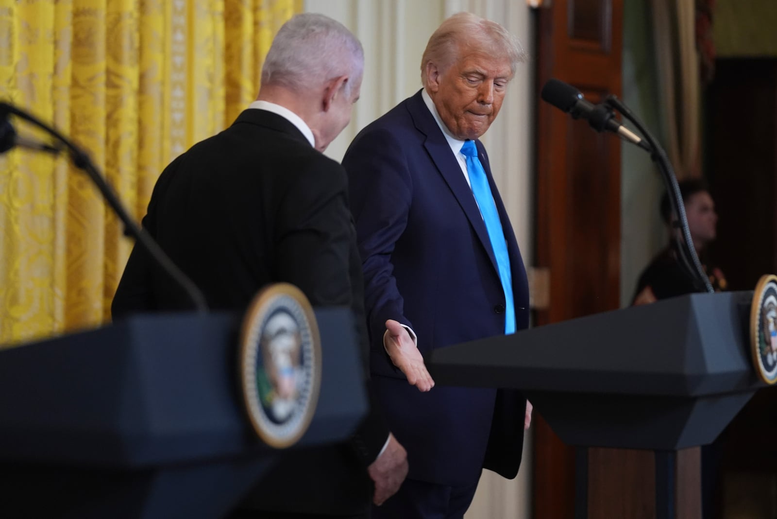 President Donald Trump shakes hands with Israel's Prime Minister Benjamin Netanyahu after a news conference in the East Room of the White House, Tuesday, Feb. 4, 2025, in Washington. (AP Photo/Evan Vucci)