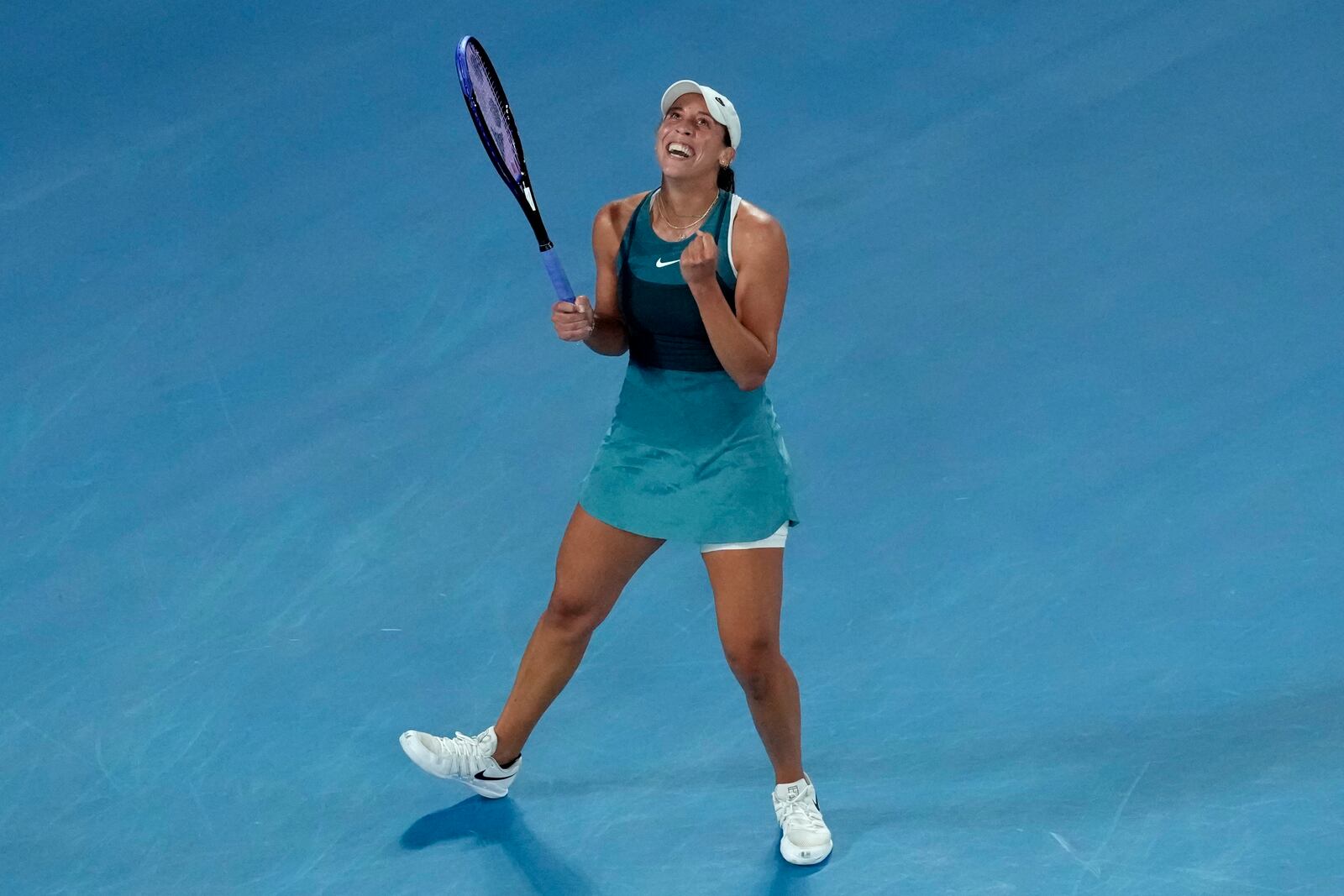 Madison Keys of the U.S. celebrates after defeating Iga Swiatek of Poland in their semifinal match at the Australian Open tennis championship in Melbourne, Australia, early Friday, Jan. 24, 2025. (AP Photo/Manish Swarup)