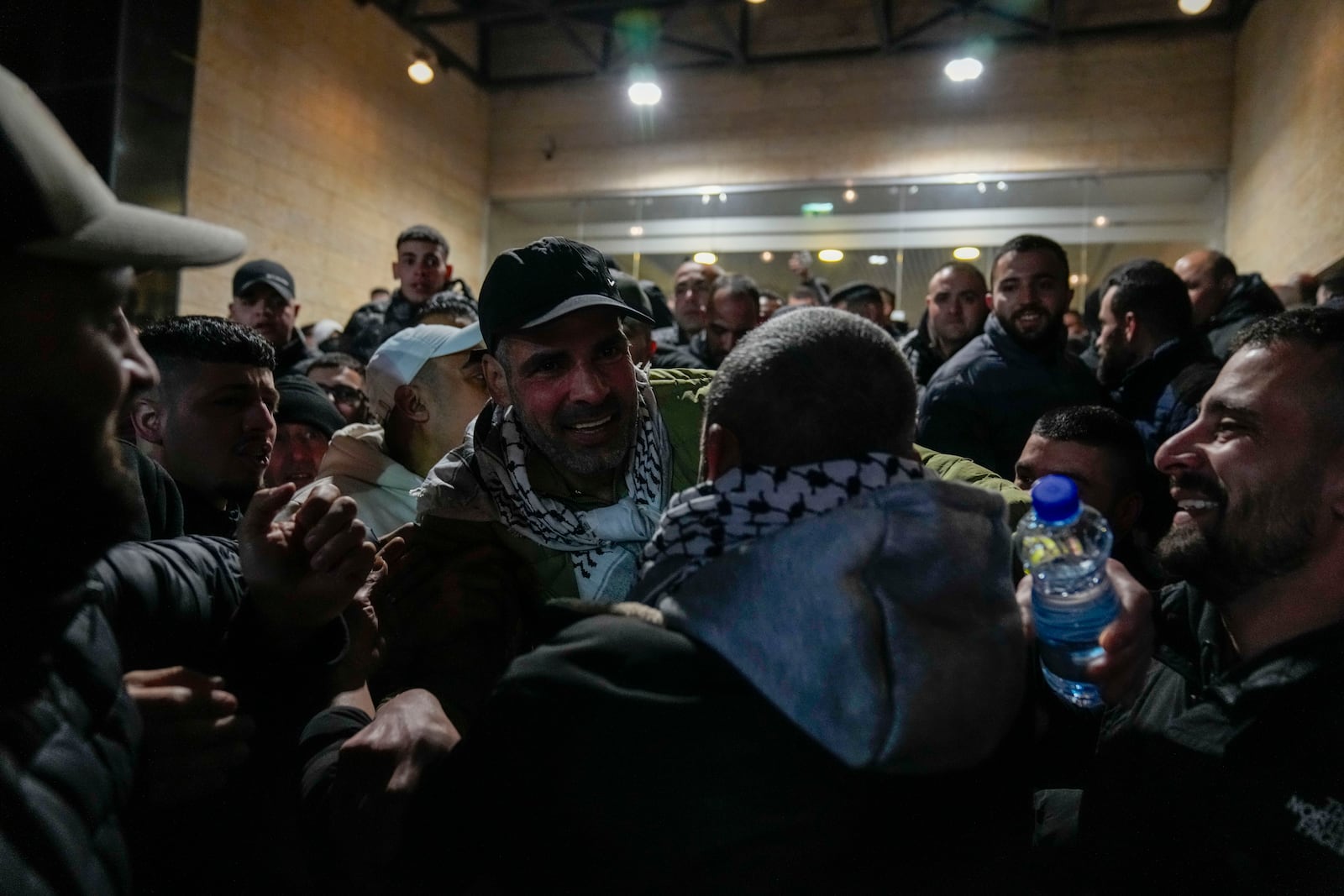 Palestinian prisoners are greeted after being released from Israeli prison following a ceasefire agreement between Israel and Hamas, in the West Bank city of Ramallah, Thursday, Feb. 27, 2025. (AP Photo/Nasser Nasser)