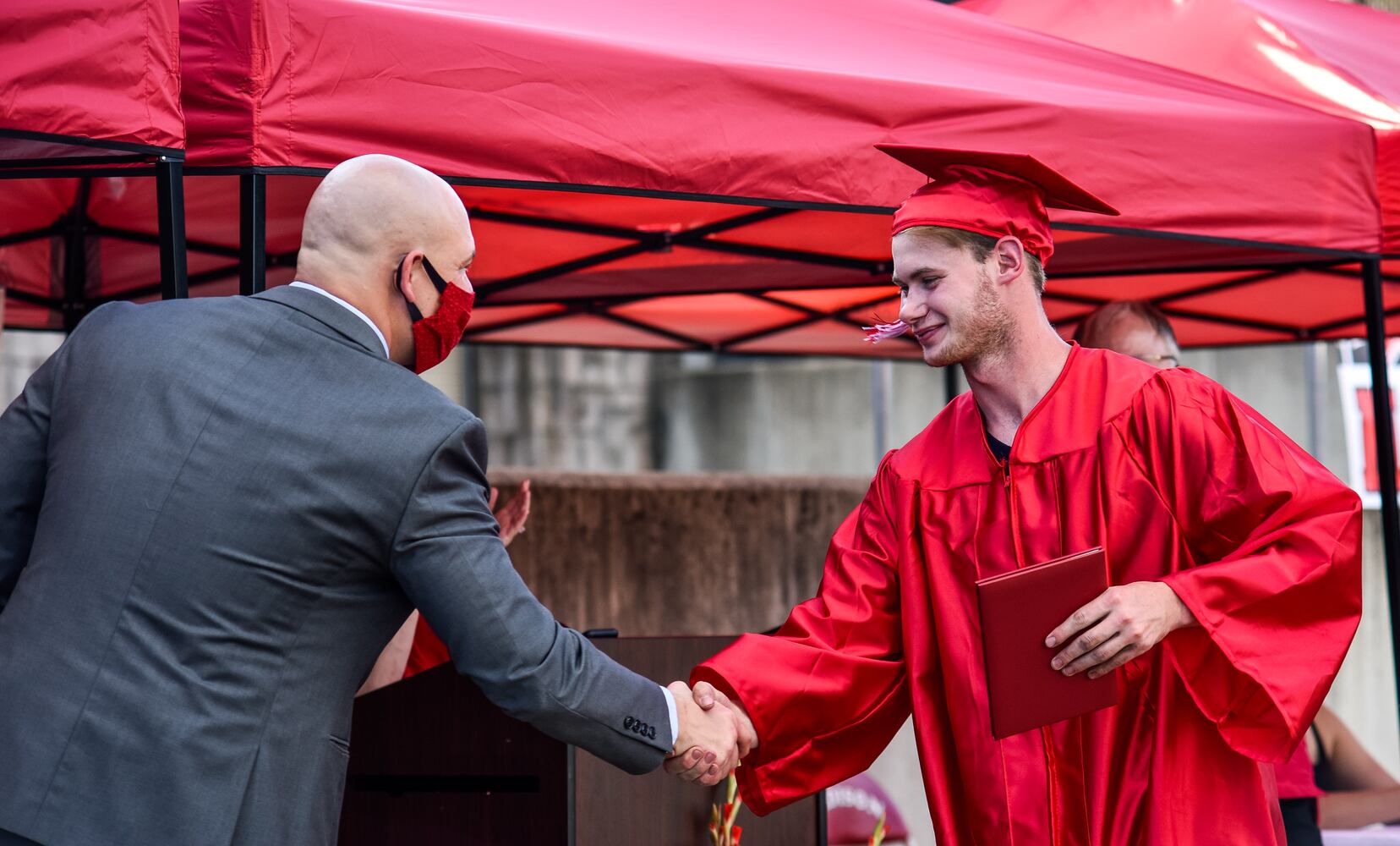 Madison High School drive-thru graduation ceremony at Land of Illusion