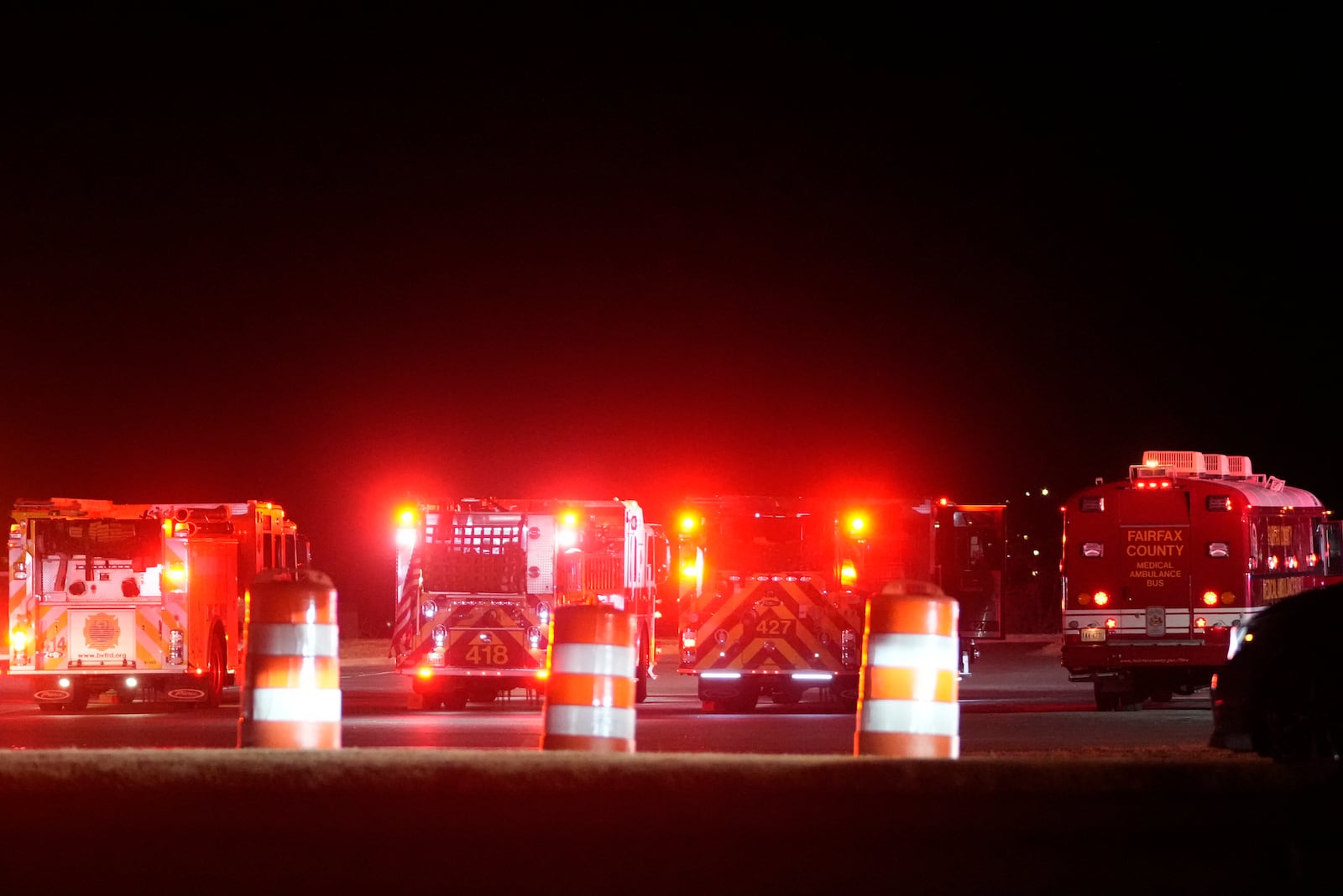 Emergency equipment stages at Gravelly Point, north of Ronald Reagan Washington National Airport, along the Potomac River, Wednesday, Jan. 29, 2025, in Arlington, Va. (AP Photo/Mark Schiefelbein)