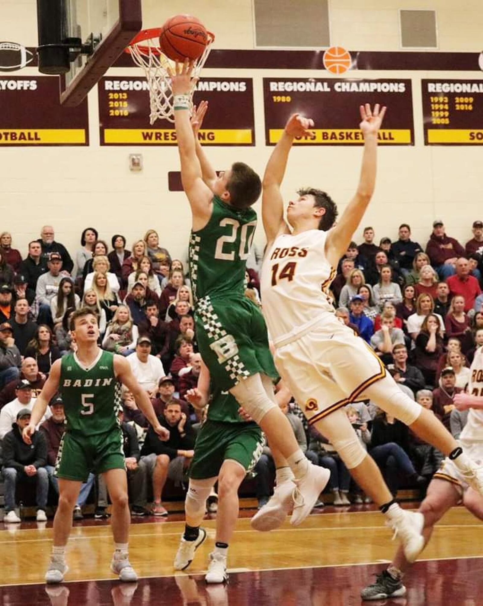 Badin’s Alex DeLong (20) beats Cooper Shields of Ross to the basket during Saturday night’s game at Ross. Badin won 51-38. CONTRIBUTED PHOTO BY TERRI ADAMS