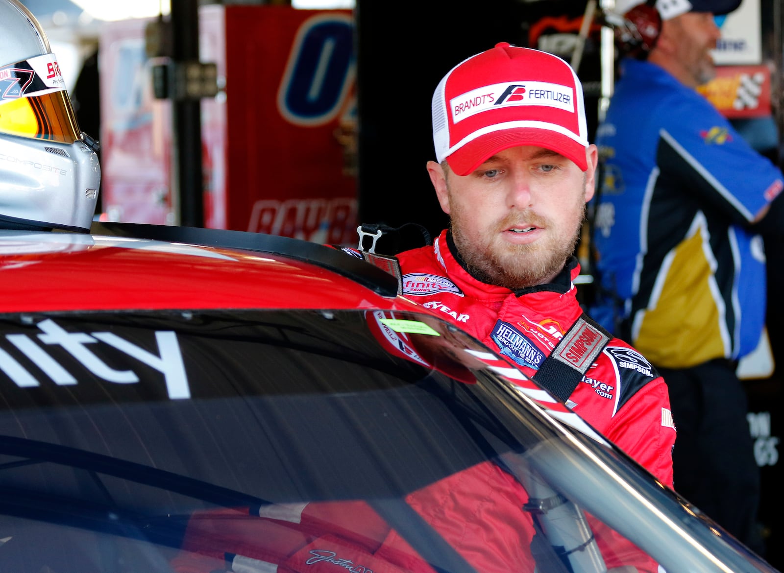 FILE - Justin Allgaier gets in his car before practice for a NASCAR auto race at Darlington Race way, Sept. 3, 2016, in Darlington, S.C. (AP Photo/Terry Renna, file)