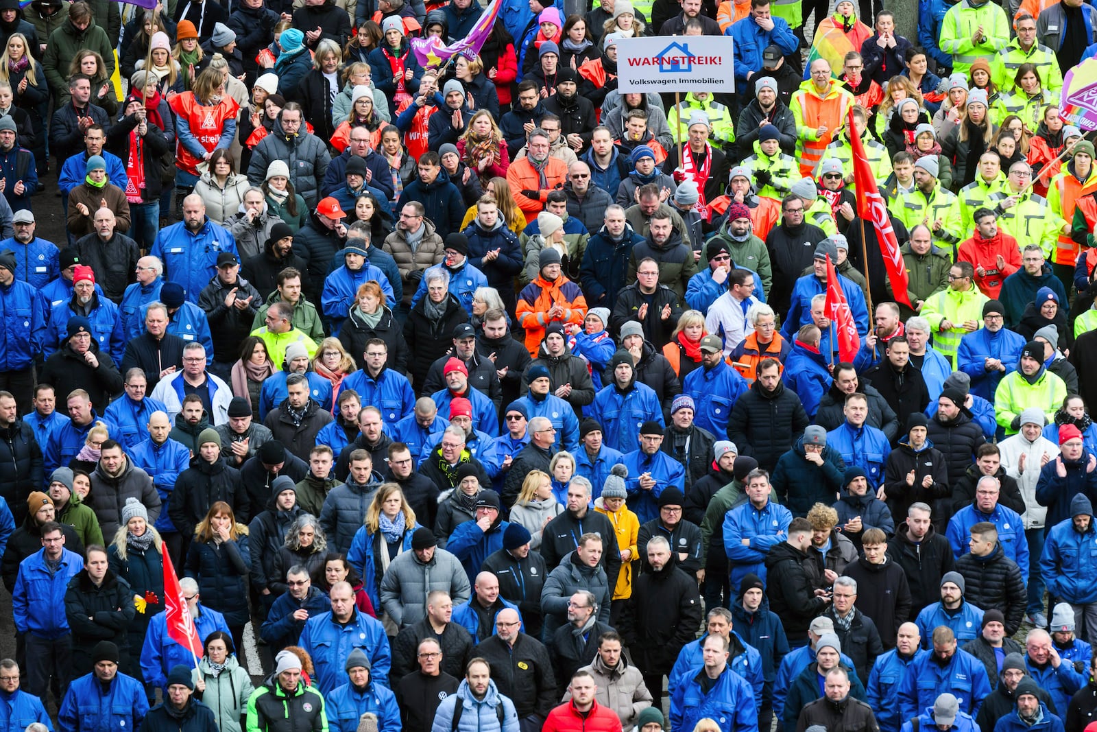 Volkswagen workers attend at a rally during at nationwide warning Volkswagen workers' strike, on the grounds of the main Volkswagen plant in Wolfsburg, Germany, Monday, Dec. 2, 2024. (Julian Stratenschulte/Pool Photo via AP)