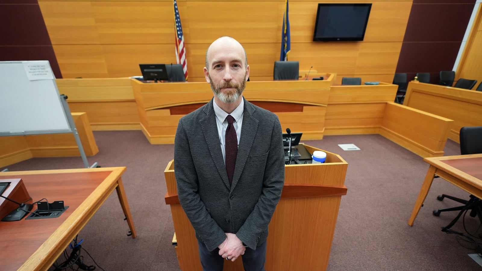 Michigan State University Associate Professor of Law Justin Simard poses in the School of Law Moot Court, Tuesday, Feb. 18, 2025 in East Lansing, Mich. (AP Photo/Paul Sancya)