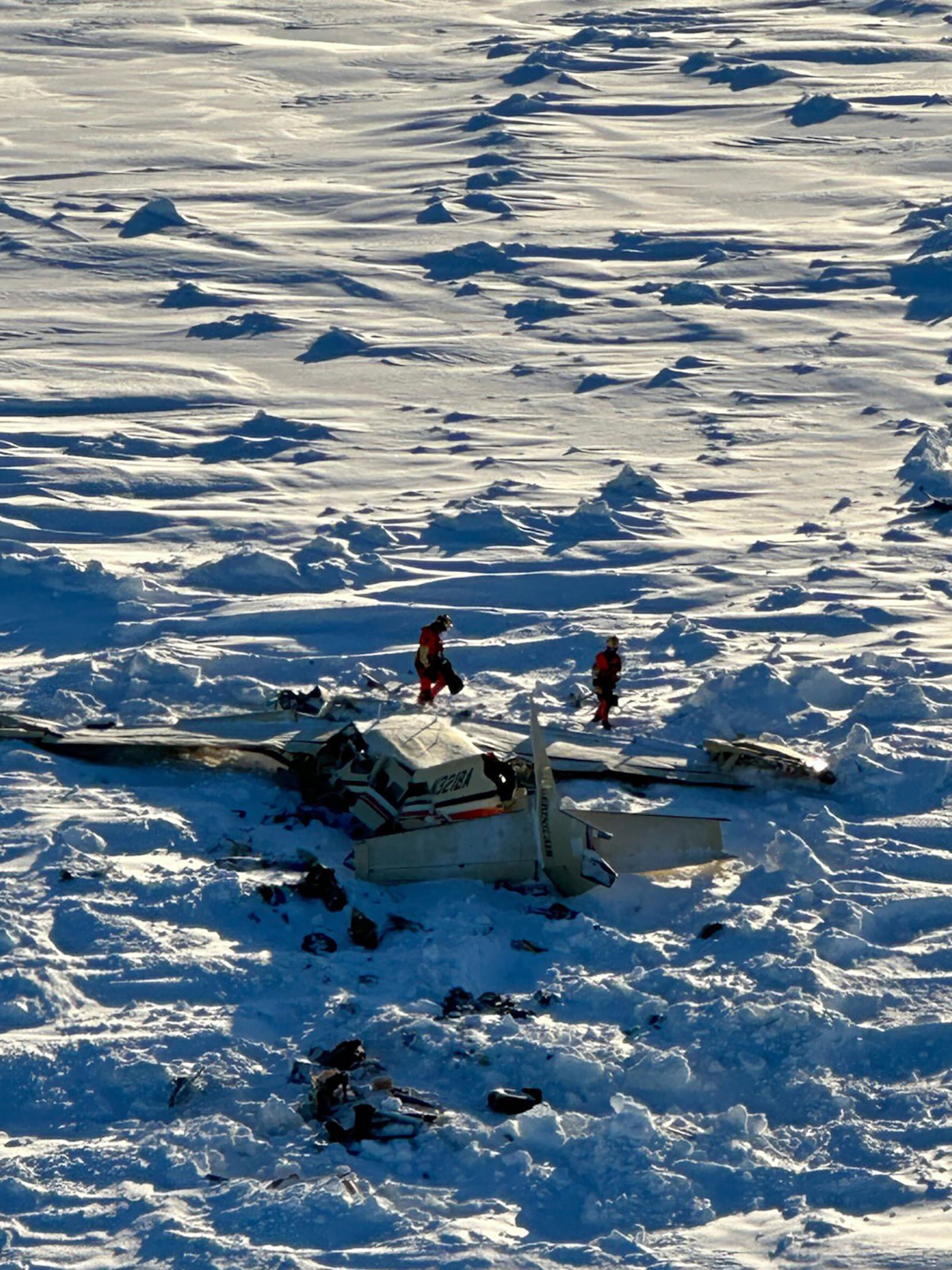 This photo provided by the U.S. Coast Guard on Feb. 7, 2025, shows a small commuter plane that crashed in western Alaska on a flight that was bound for the hub community of Nome. (U.S. Coast Guard via AP, File)