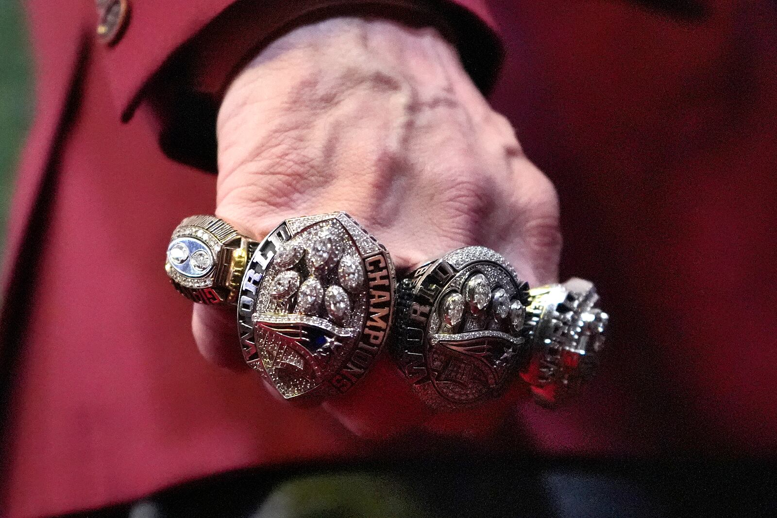 Former NFL head coach Bill Belichick shows his Super Bowl rings as he walks the red carpet at the NFL Honors award show ahead of the Super Bowl 59 football game, Thursday, Feb. 6, 2025, in New Orleans. (AP Photo/Brynn Anderson)