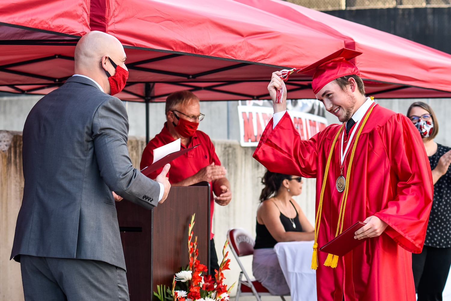 Madison High School drive-thru graduation ceremony at Land of Illusion