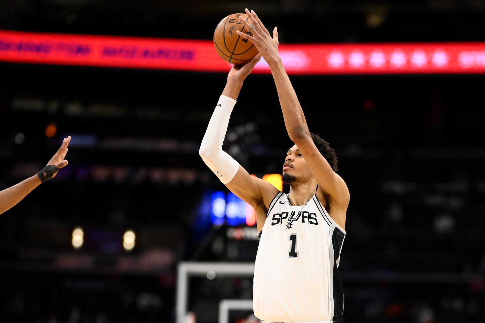 San Antonio Spurs center Victor Wembanyama looks to shoot during the first half of an NBA basketball game against the Washington Wizards, Monday, Feb. 10, 2025, in Washington. (AP Photo/Nick Wass)