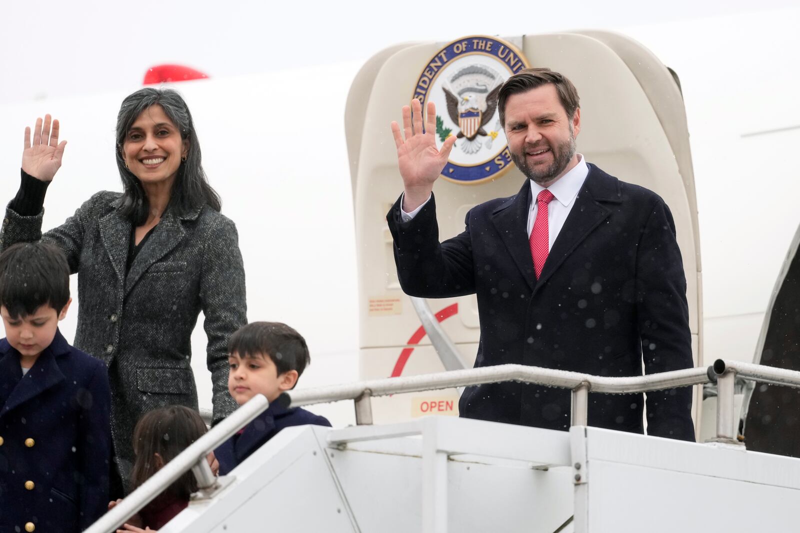 U.S. Vice President JD Vance and second lady Usha Vance, with their children Ewan, Vivek, and Mirabel, wave as they arrive at the Munich airport, in Munich, Germany, Thursday, Feb. 13, 2025. (AP Photo/Matthias Schrader)