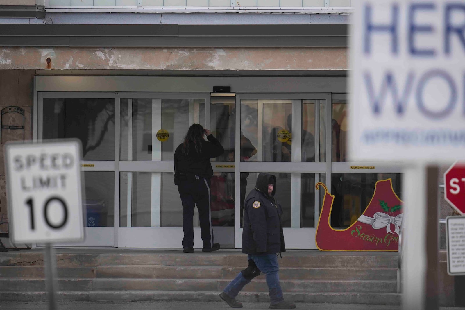 People enter Indiana State Prison where, barring last-minute court action or intervention by Gov. Eric Holcomb, Joseph Corcoran, 49, convicted in the 1997 killings of his brother and three other people, is scheduled to be put to death by lethal injection before sunrise Tuesday, Dec. 17, 2024, in Michigan City, Ind. (AP Photo/Erin Hooley)