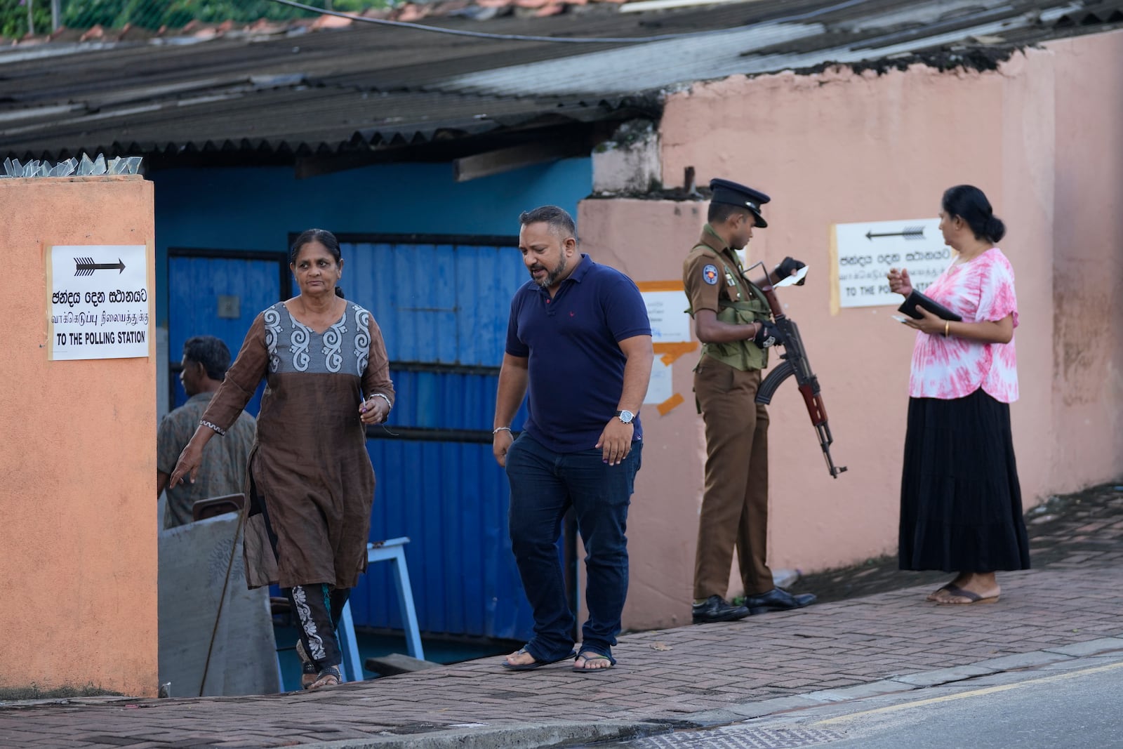 People arrive to cast their votes at a polling station during the parliamentary election in Colombo, Sri Lanka, Thursday, Nov. 14, 2024.(AP Photo/Eranga Jayawardena)