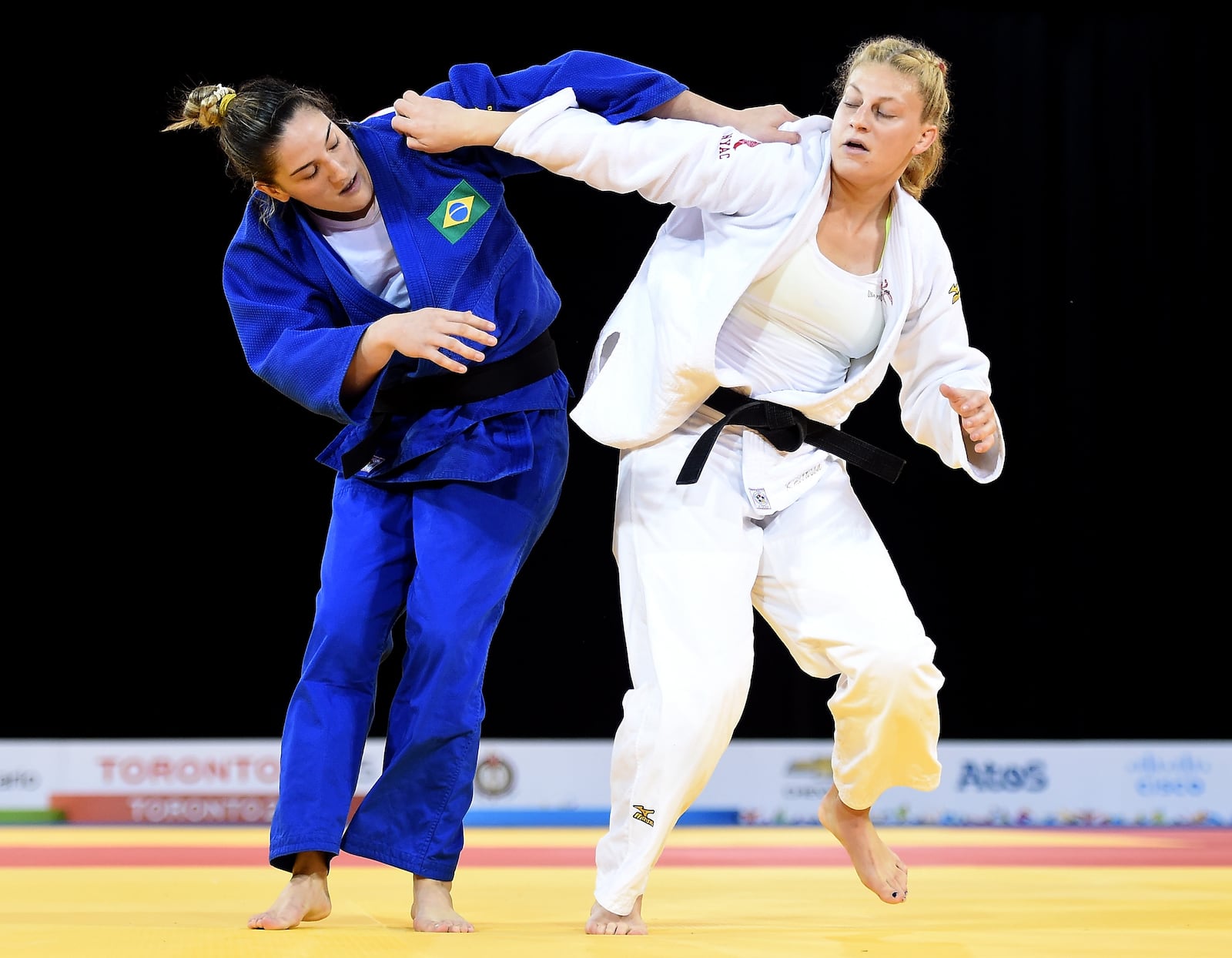 TORONTO, ON - JULY 14: Kayla Harrison of the United States of America and Mayra Aguiar of Brazil compete in the minus 100kg judo gold medal match during the 2015 Pan Am games at the Mississauga Sports Centre on July 14, 2015 in Toronto, Canada. (Photo by Harry How/Getty Images)