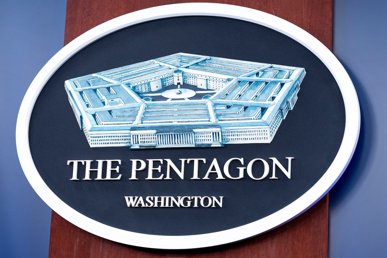 FILE - The Department of Defense logo is seen on the wall in the Press Briefing room at the Pentagon, Oct. 29, 2024, in Washington. (AP Photo/Kevin Wolf, File)