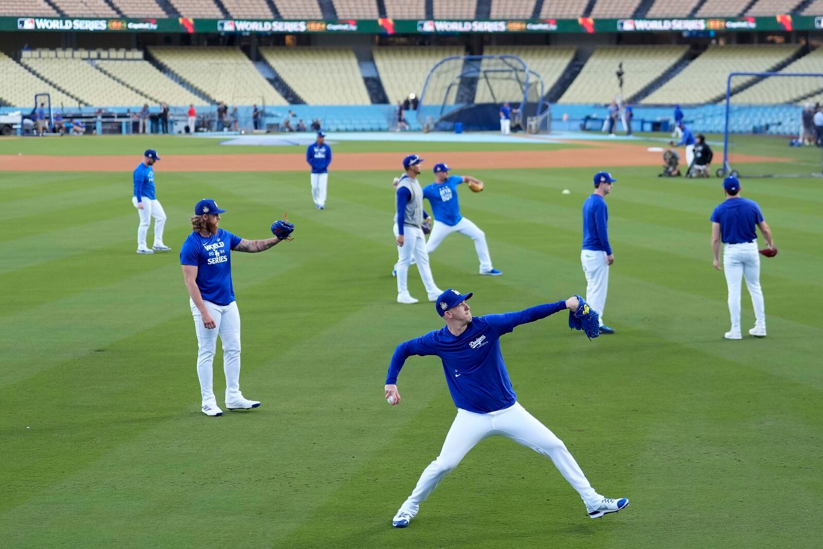 Los Angeles Dodgers pitcher Jack Flaherty warms up during batting practice during media day for the baseball World Series against the New York Yankees, Thursday, Oct. 24, 2024, in Los Angeles. (AP Photo/Ashley Landis)