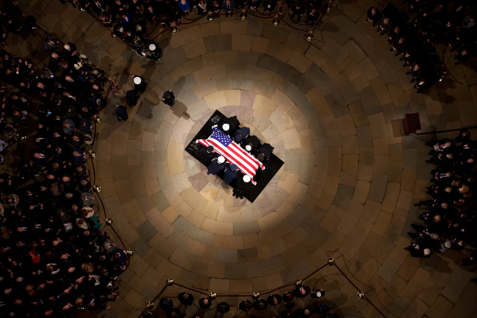 The flag-draped casket of former President Jimmy Carter lies in state at the rotunda of the U.S. Capitol Tuesday, Jan. 7, 2025, in Washington. (Andrew Harnik/Pool via AP)