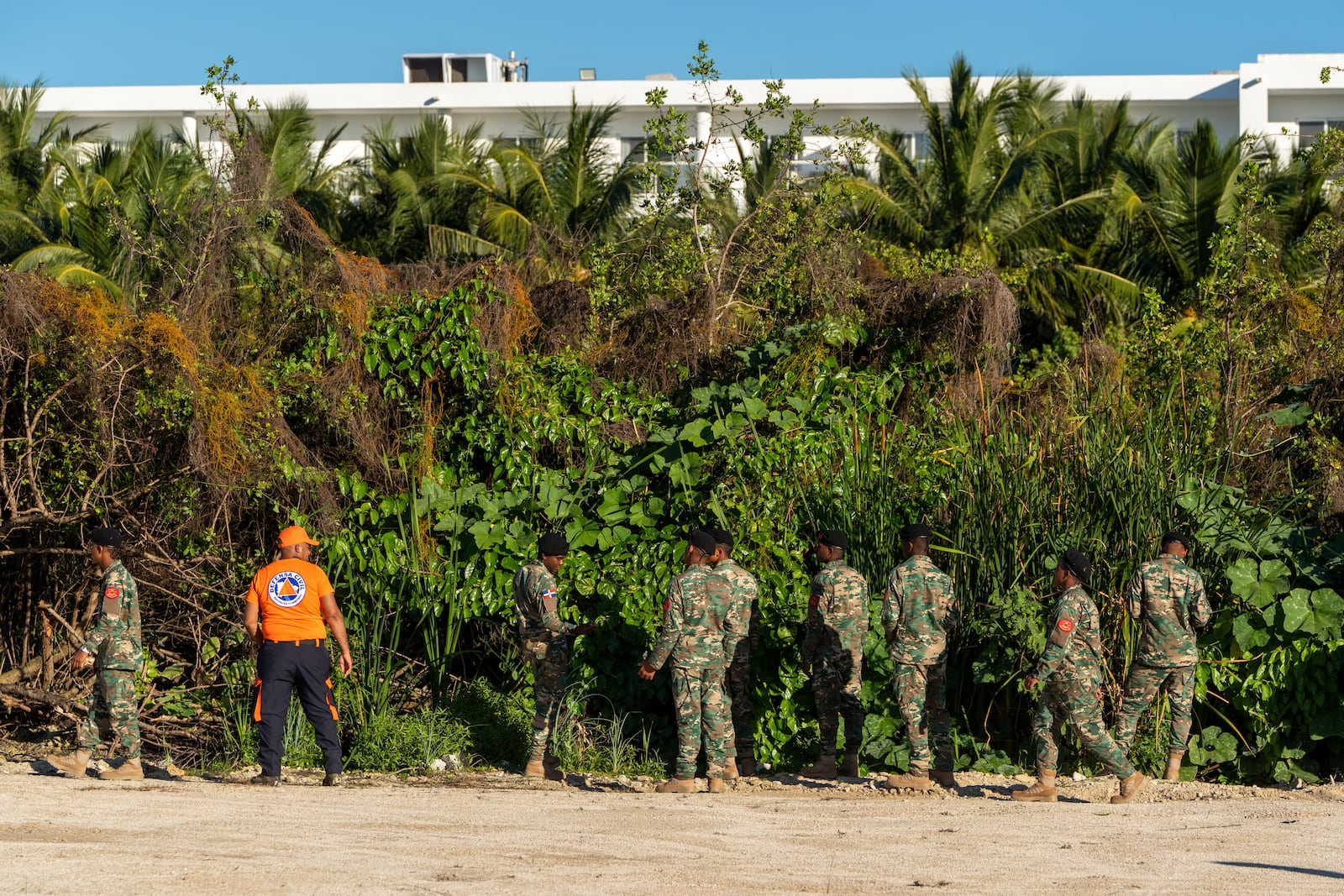 Military personnel and civil defense members search for Sudiksha Konanki, a university student from the U.S. who disappeared on a beach in Punta Cana, Dominican Republic, Monday, March. 10, 2025. (AP Photo/Francesco Spotorno)